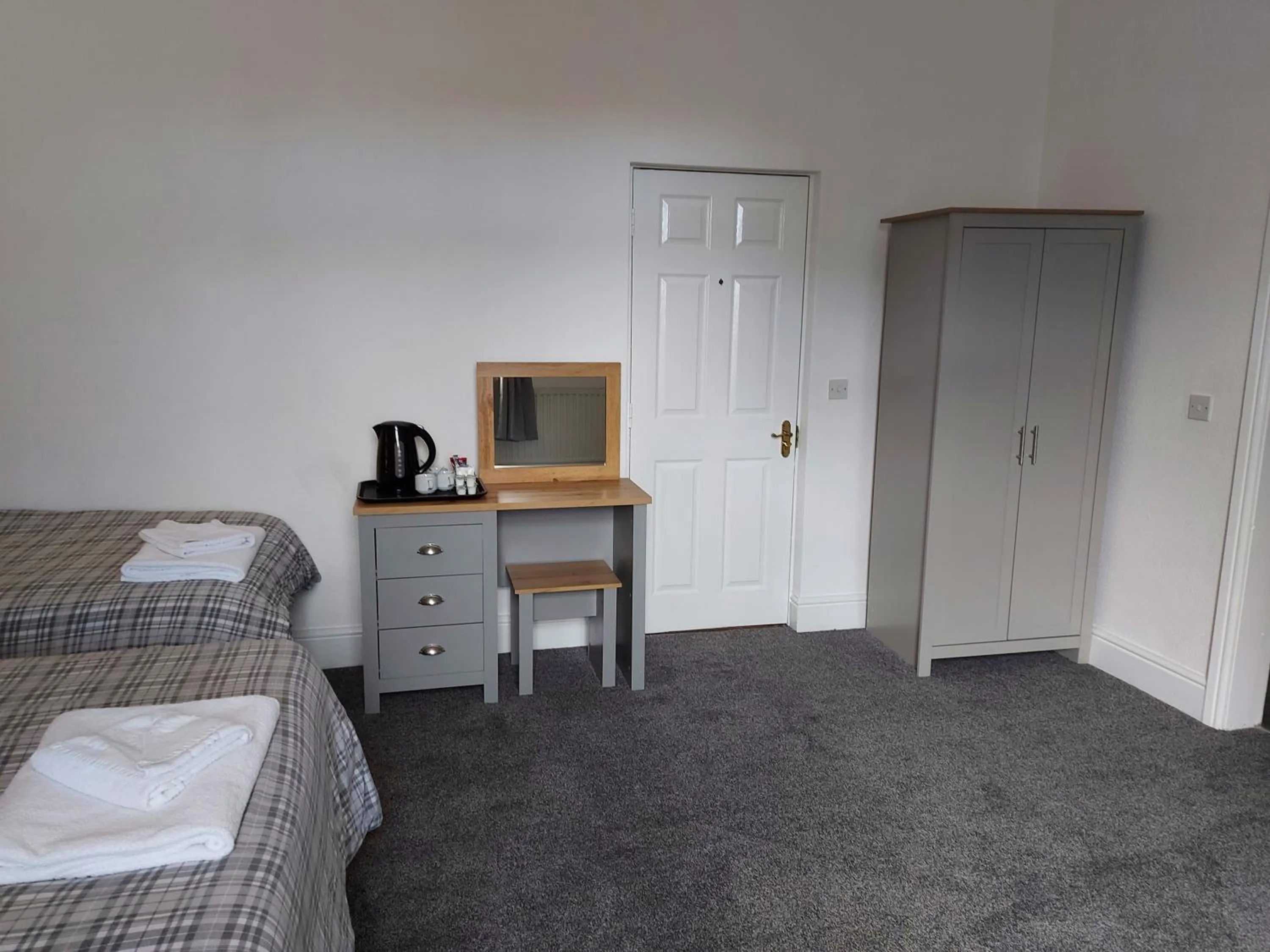 Bed in Ambrose Hotel