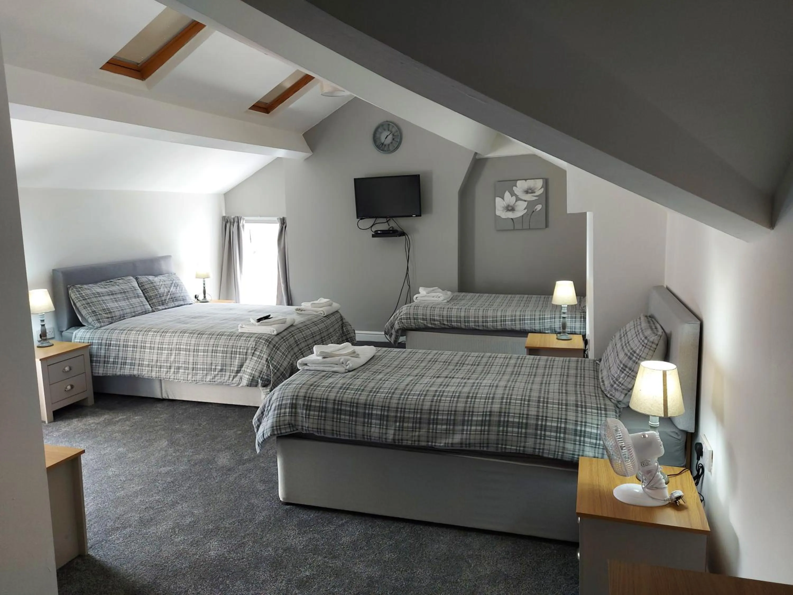 Bed in Ambrose Hotel