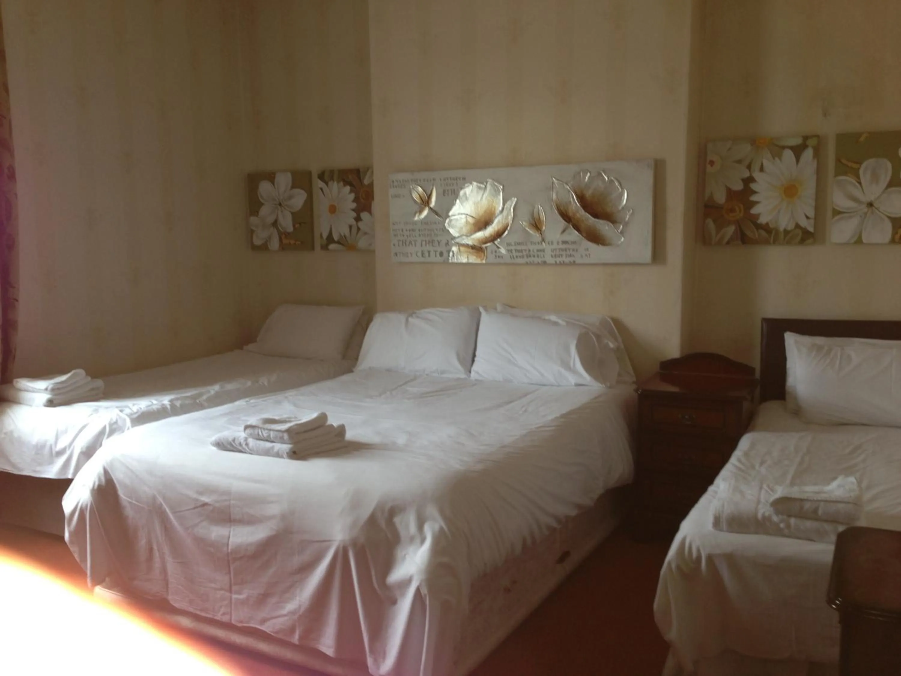 Bed in Ambrose Hotel