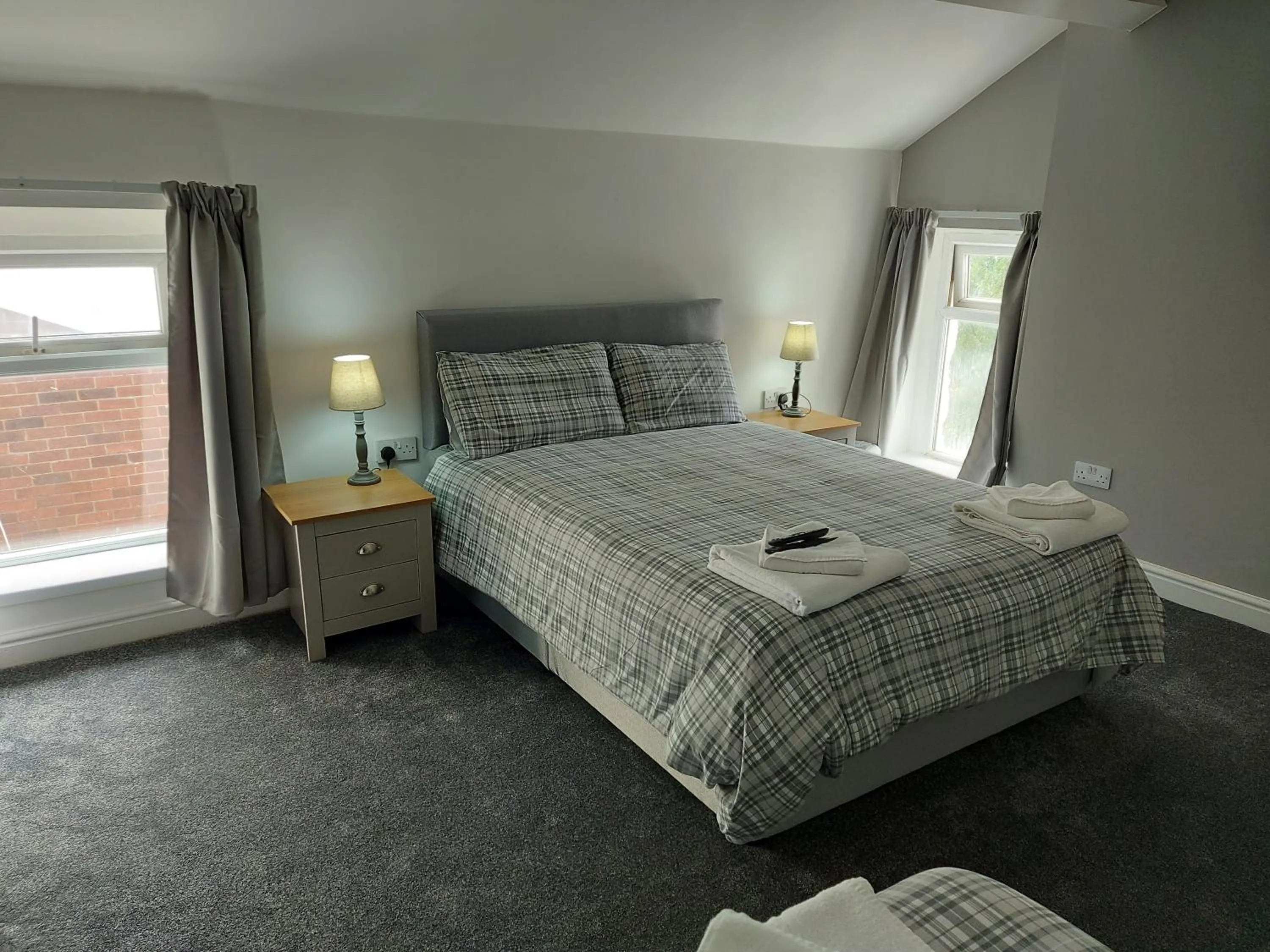 Bed in Ambrose Hotel