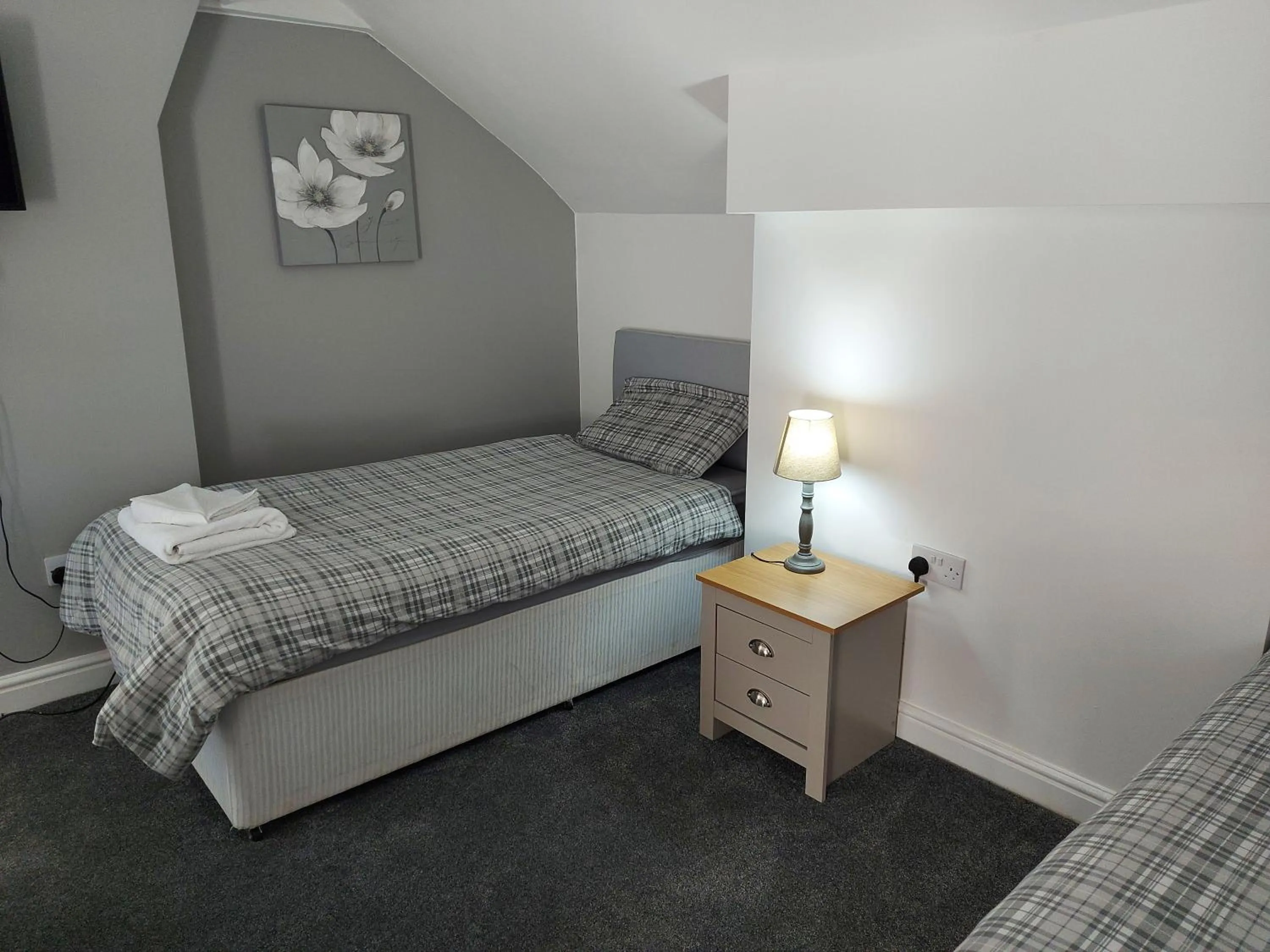 Bed in Ambrose Hotel