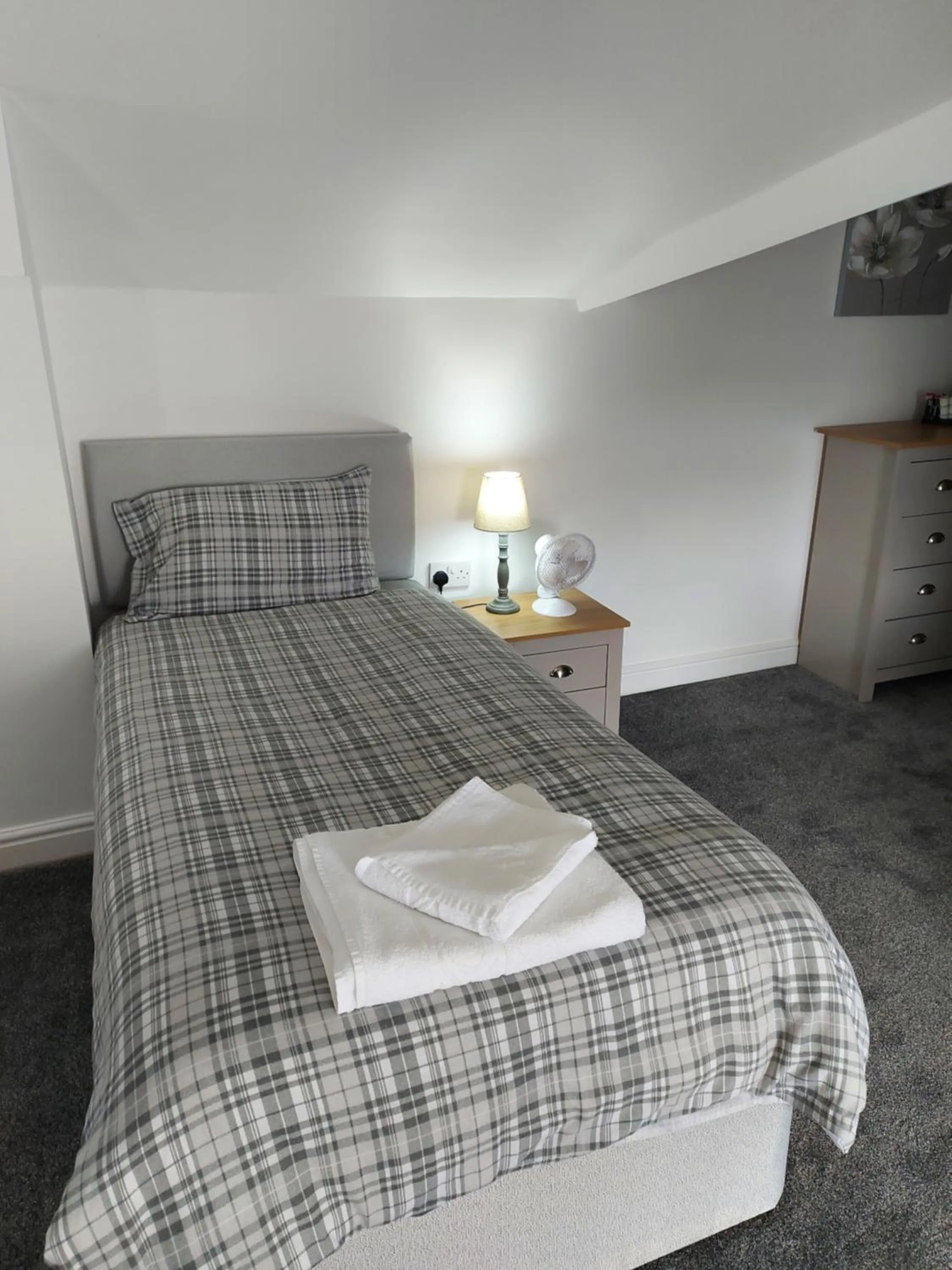 Bed in Ambrose Hotel