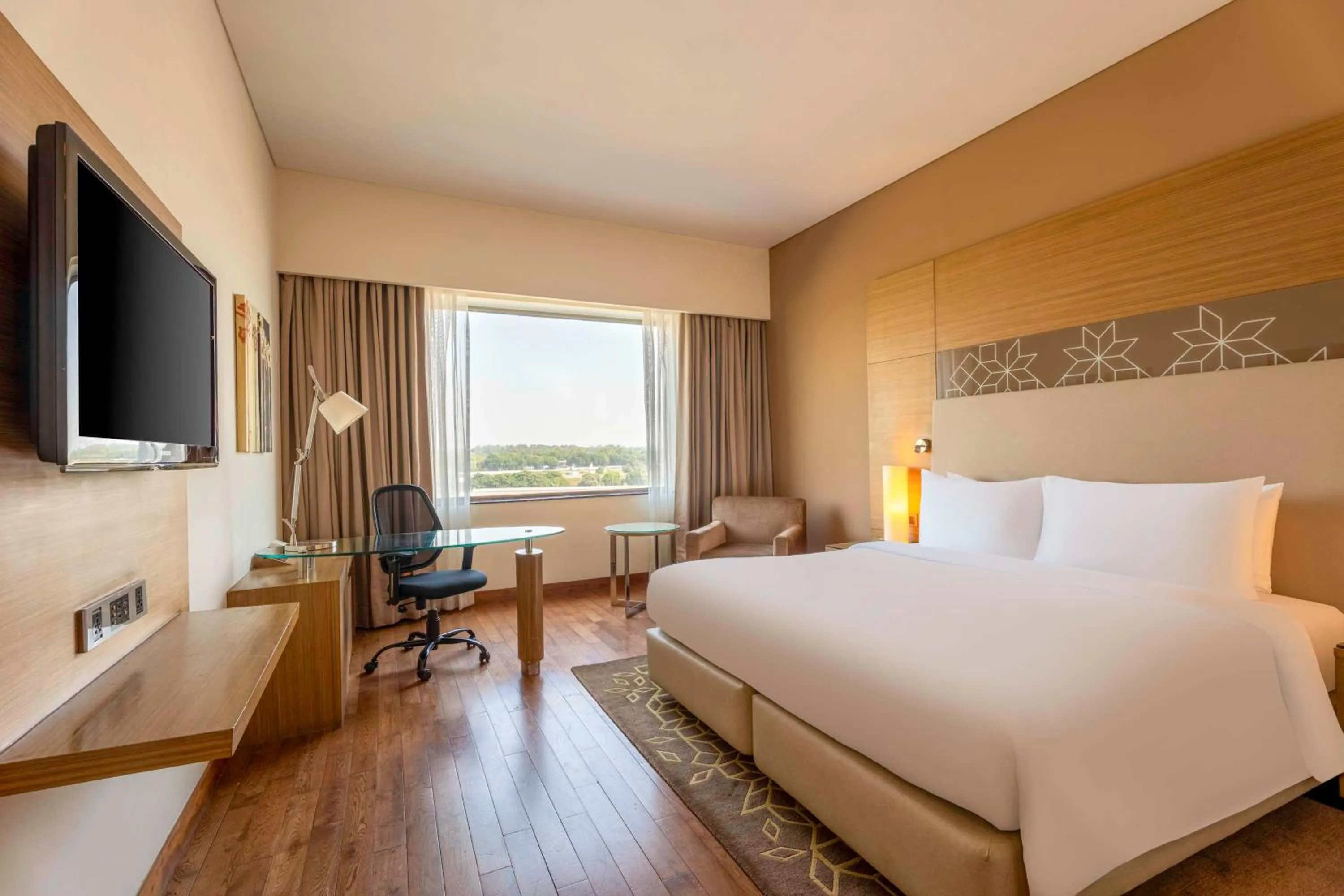 Bedroom, Bed in Radisson Gurugram Udyog Vihar