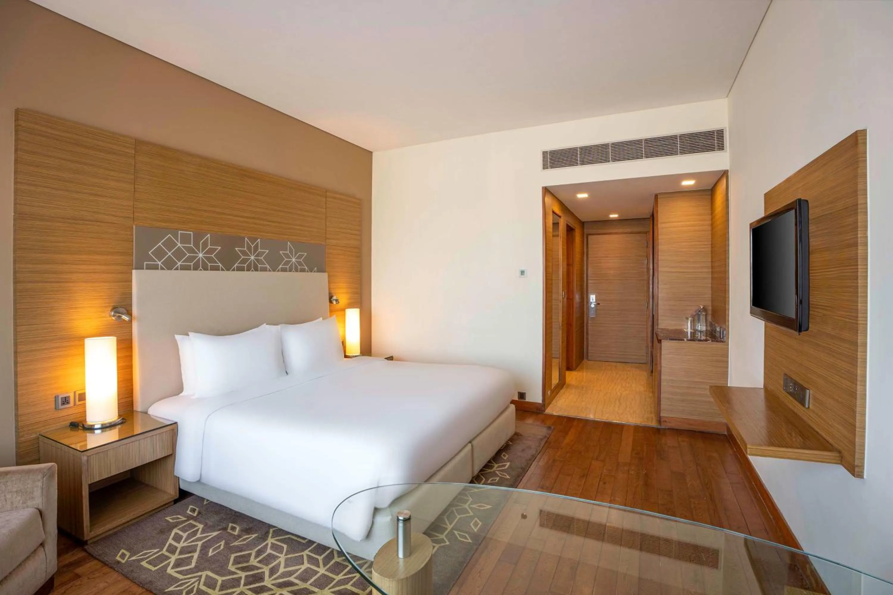 Bedroom, Bed in Radisson Gurugram Udyog Vihar