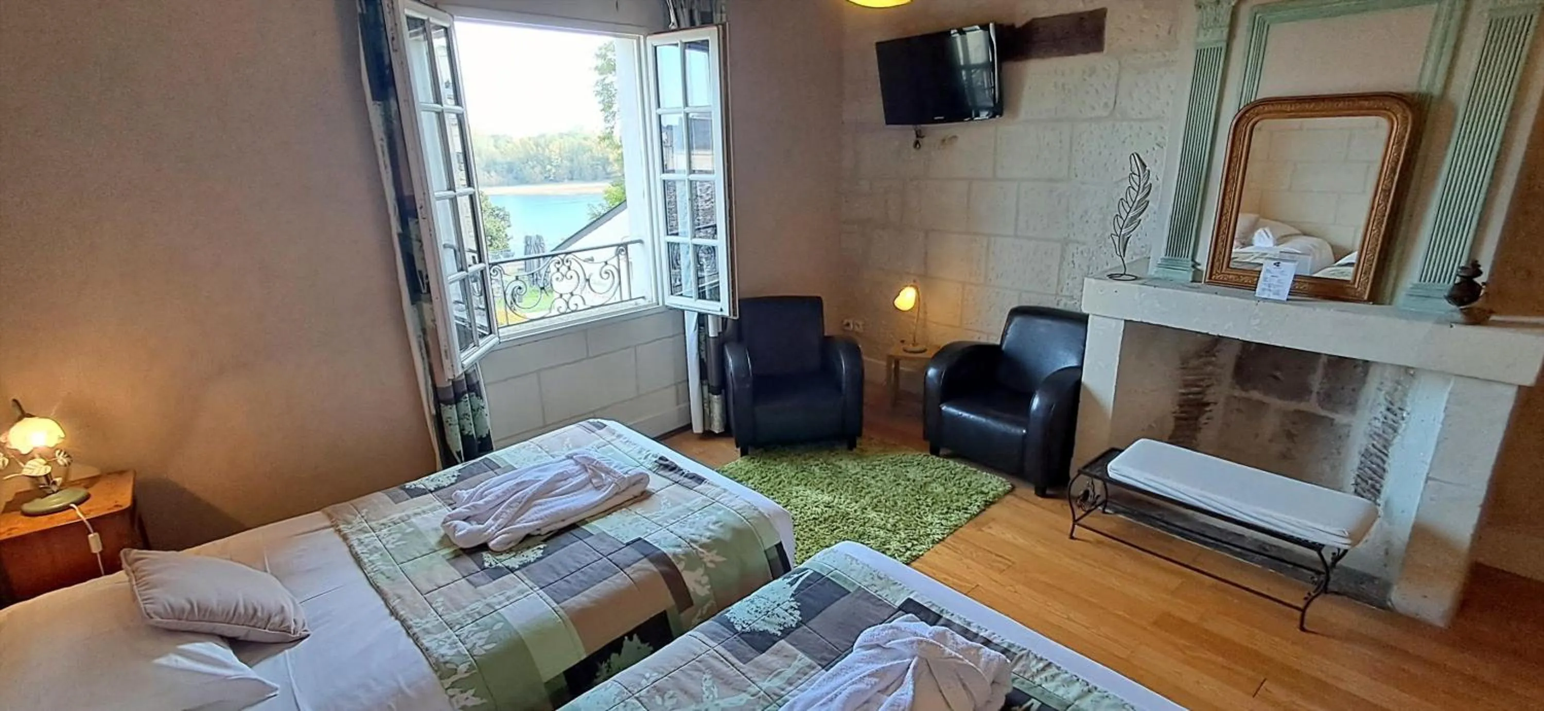 Bed in Logis Hôtel Le Bussy