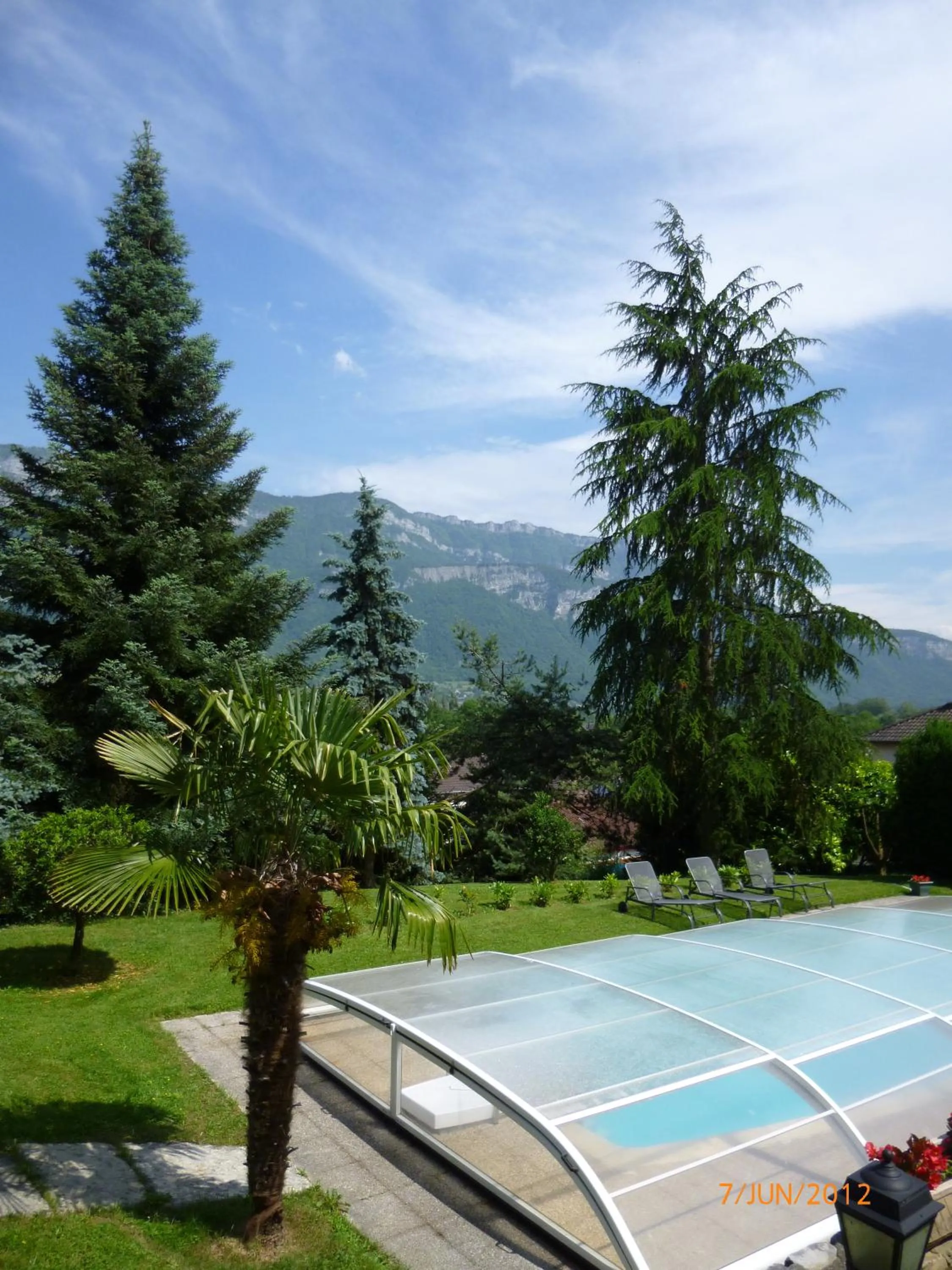 Swimming pool in Demeure d'hôtes Les Irisynes