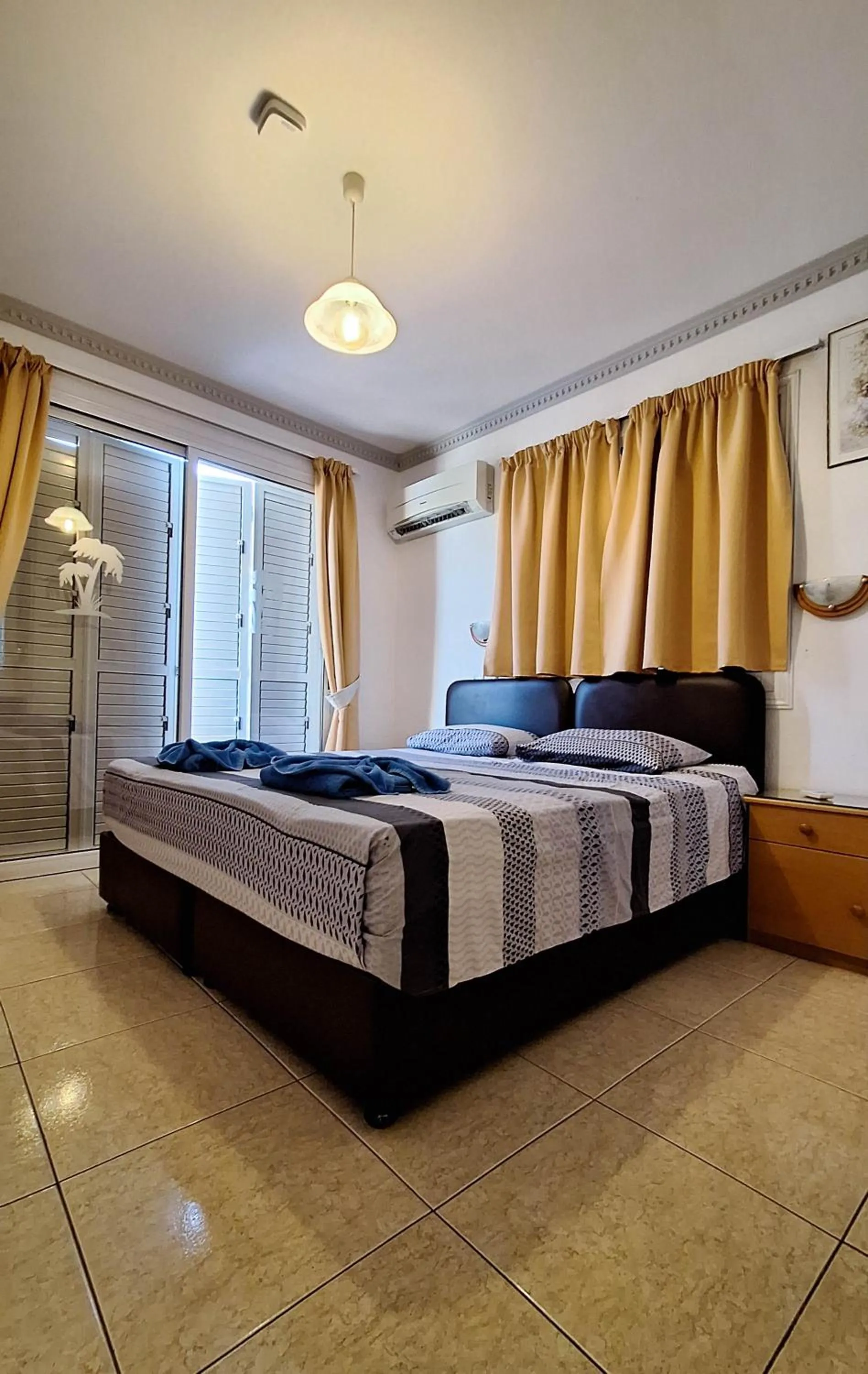 Bed in Apollonia Hotel Apartments