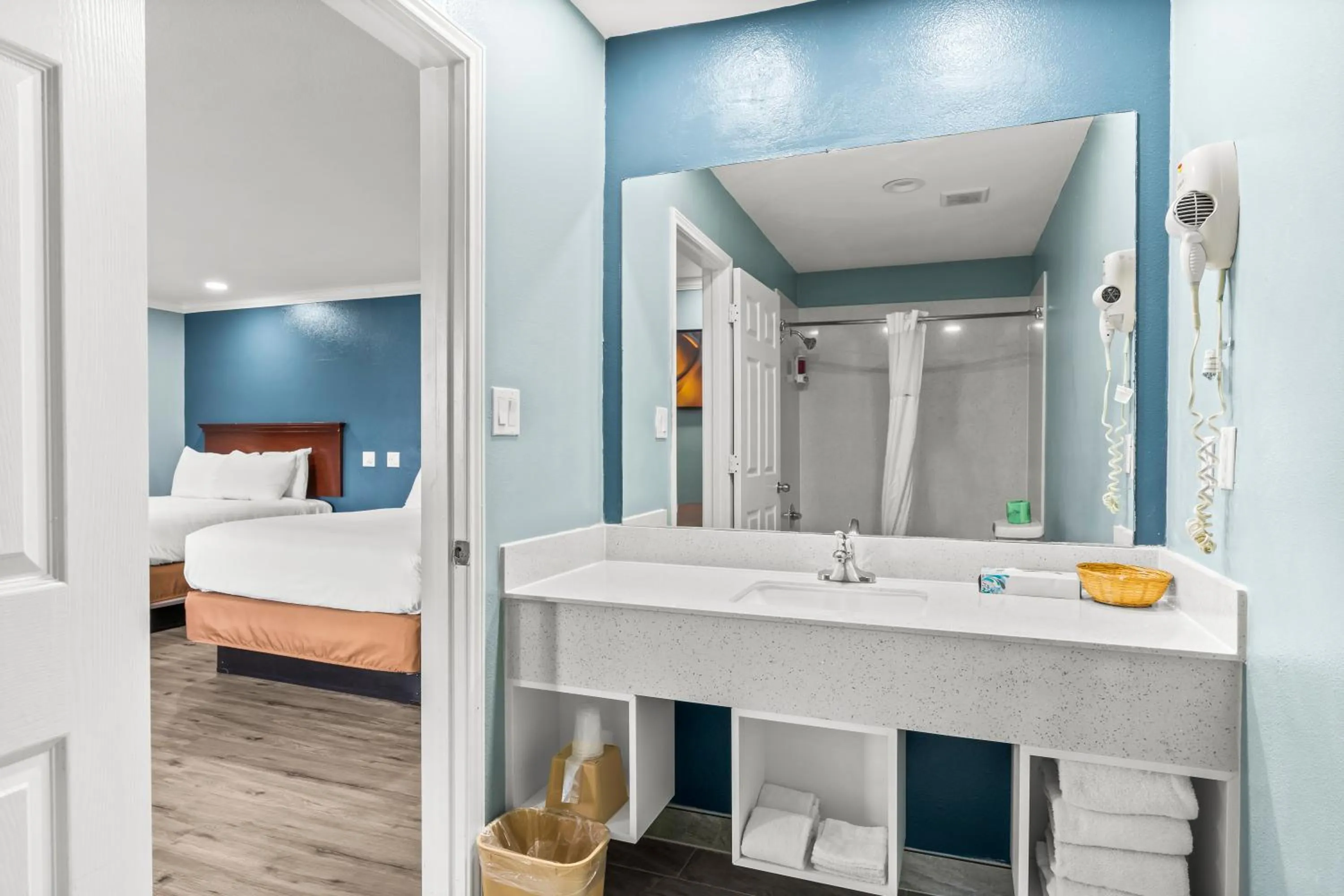 Bed in Executive Inn & Suites Magnolia