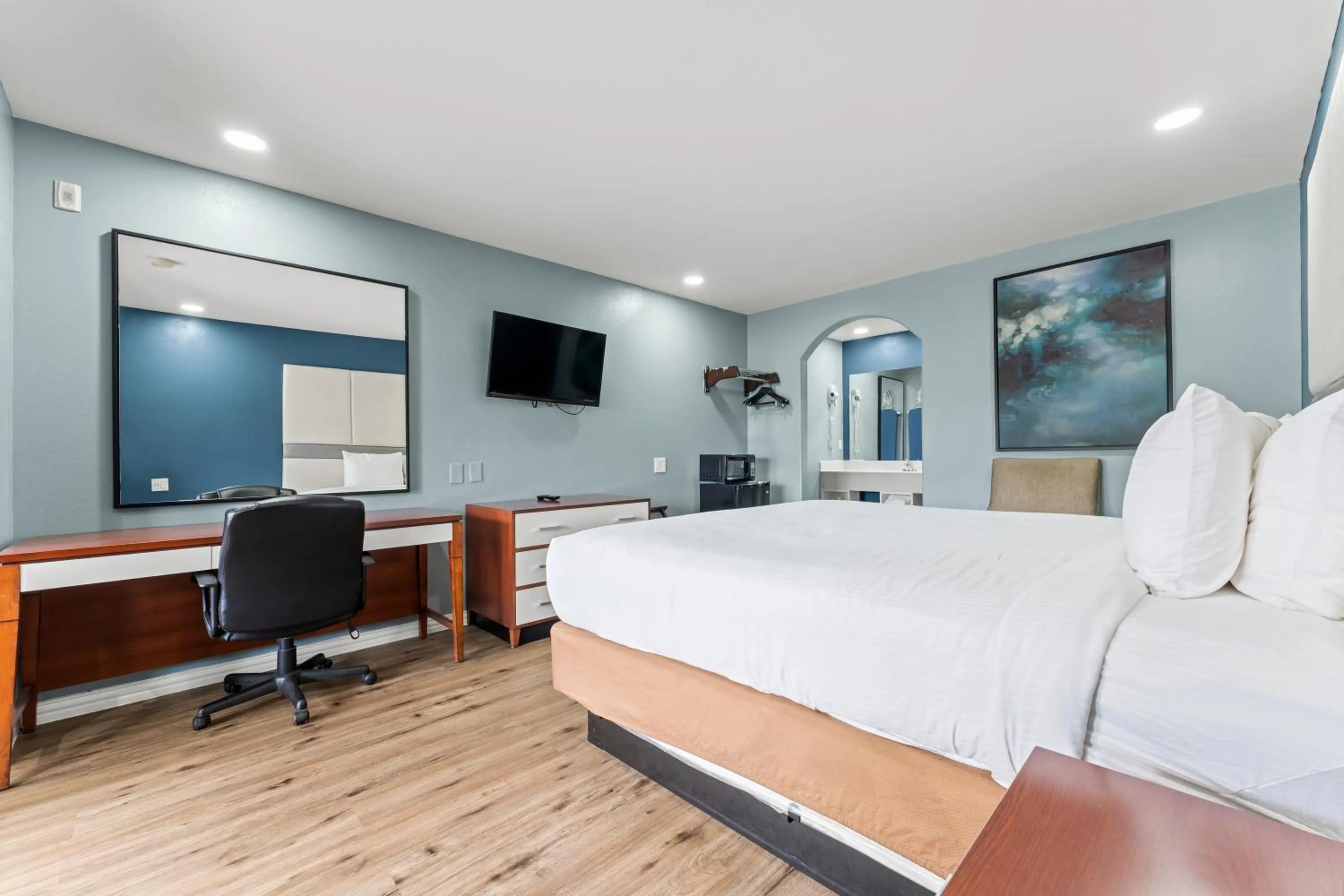 Bed in Executive Inn & Suites Magnolia