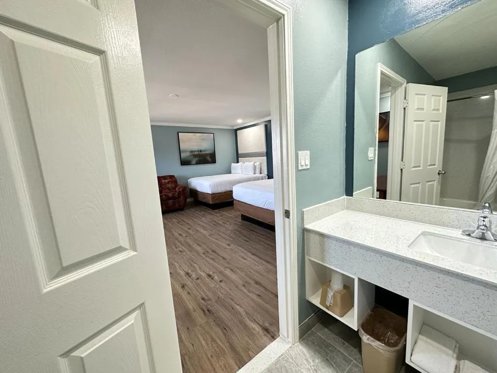 Bed in Executive Inn & Suites Magnolia