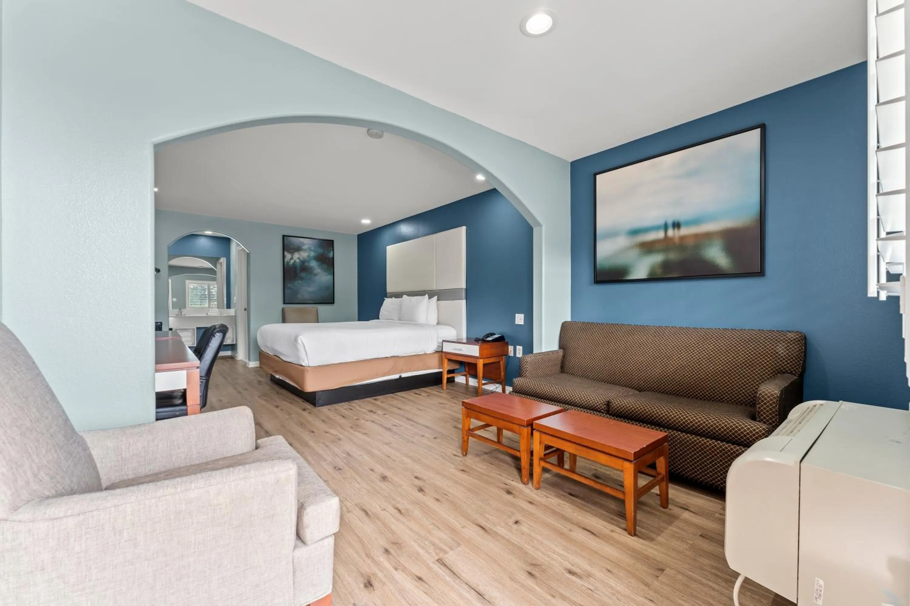 Bed in Executive Inn & Suites Magnolia