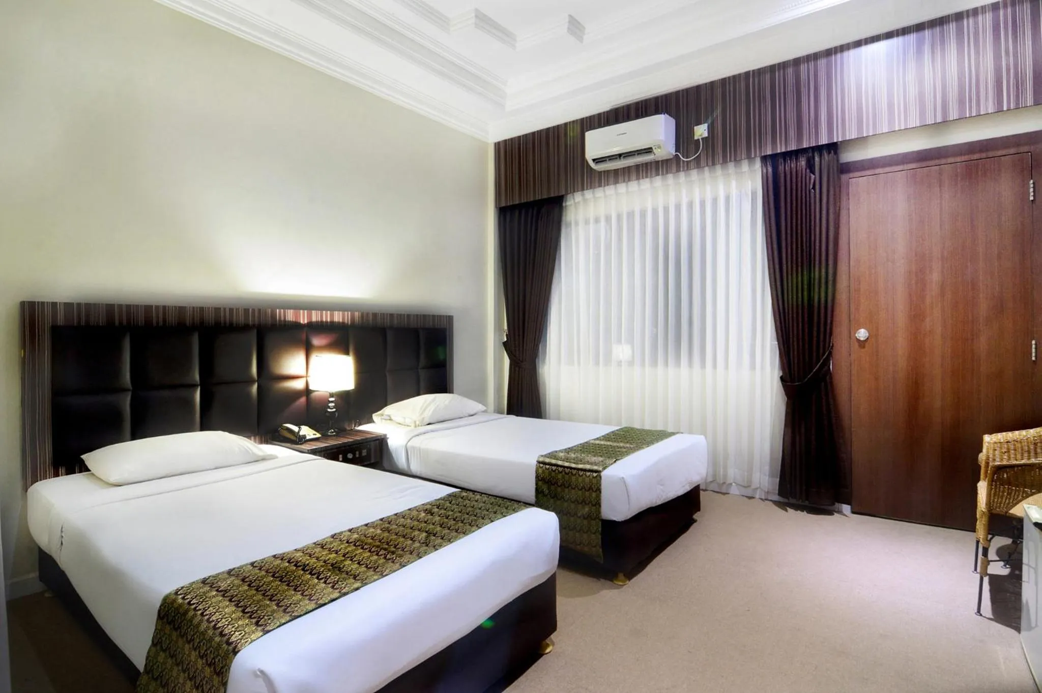 Bed in Pelangi Hotel & Resort