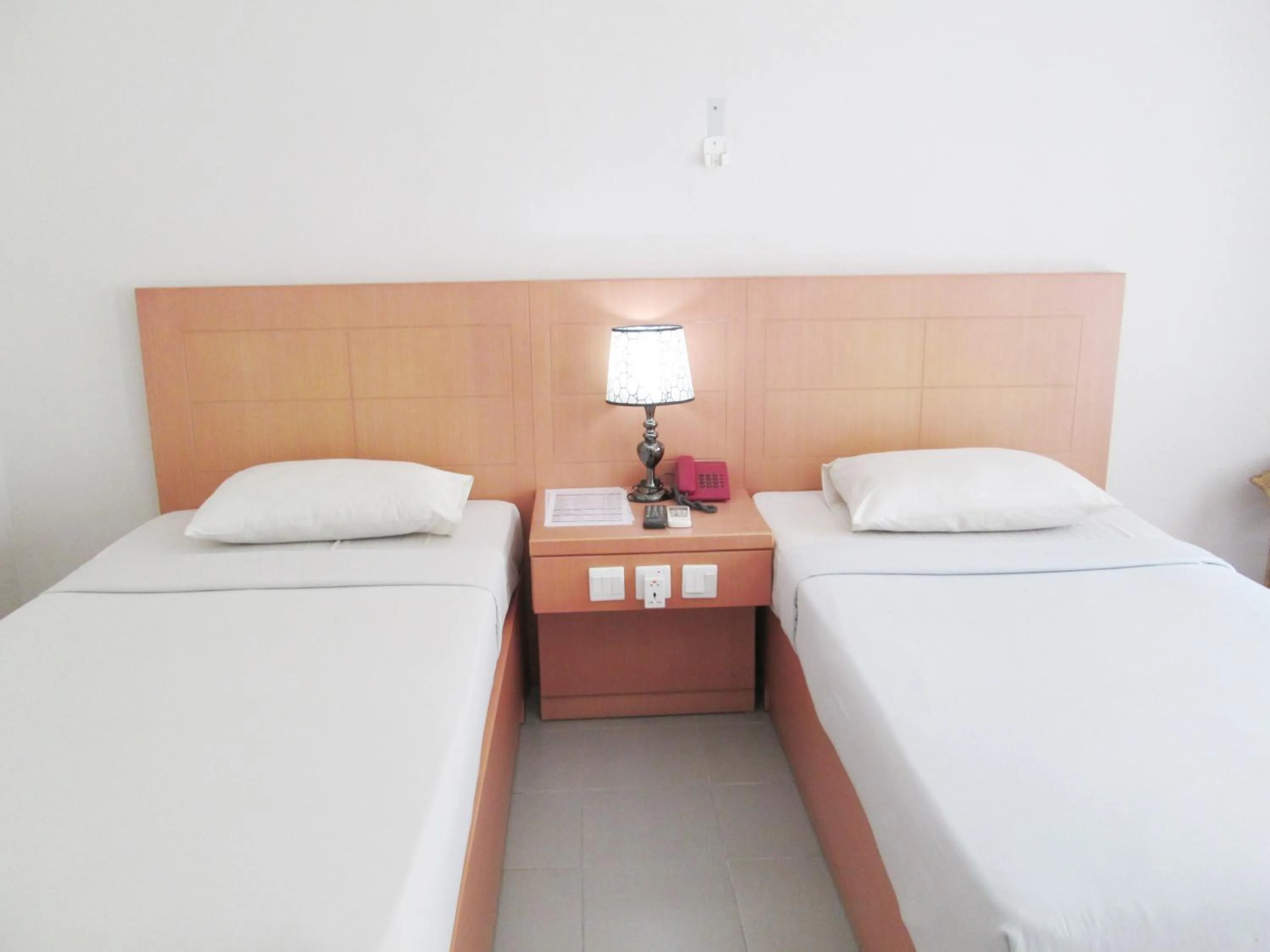 Bed in Pelangi Hotel & Resort