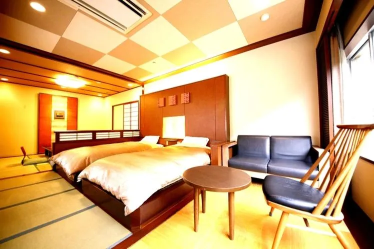 Living room, Bed in Hotel Okuyumoto