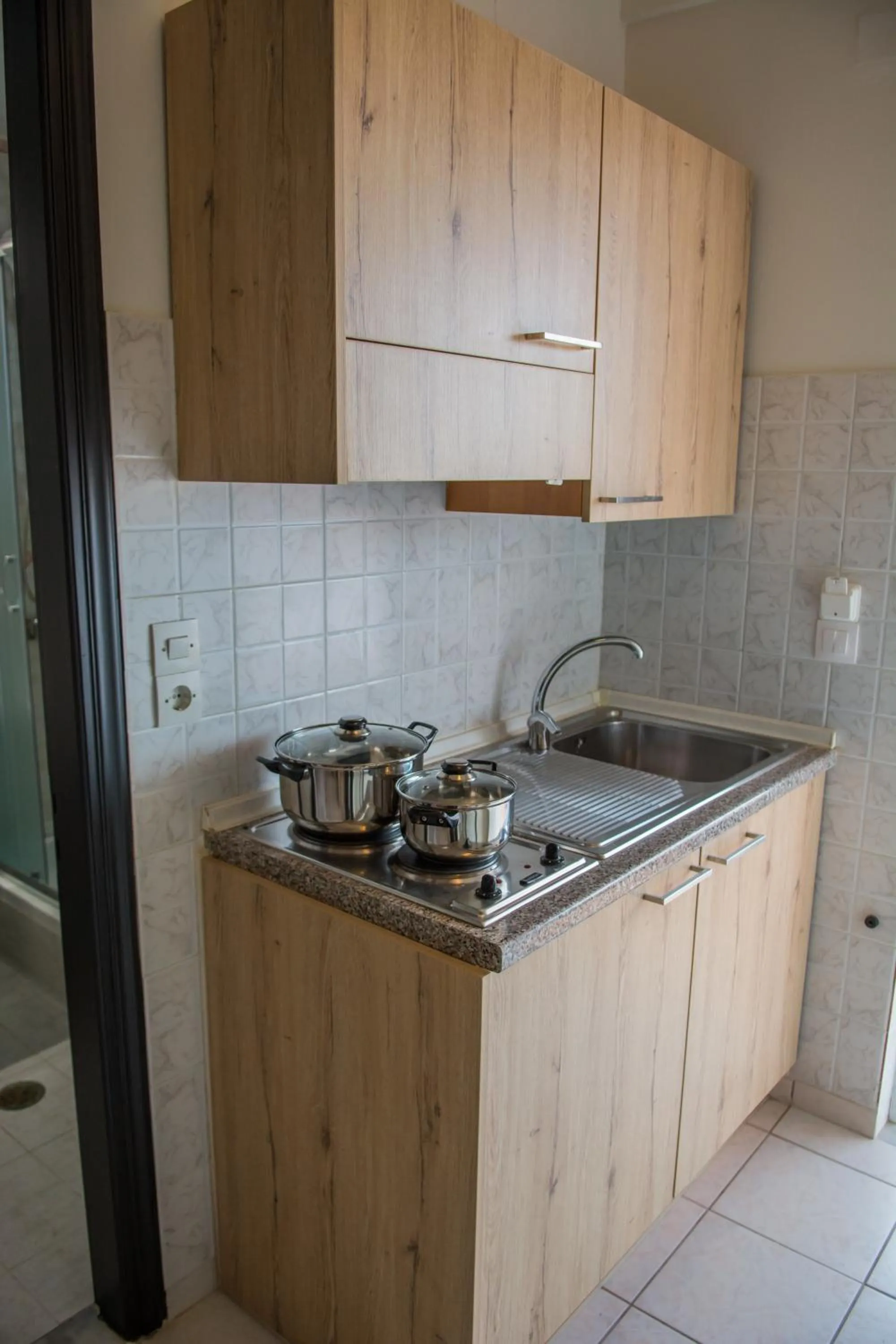 Kitchen or kitchenette in Riposo Studios & Apartments