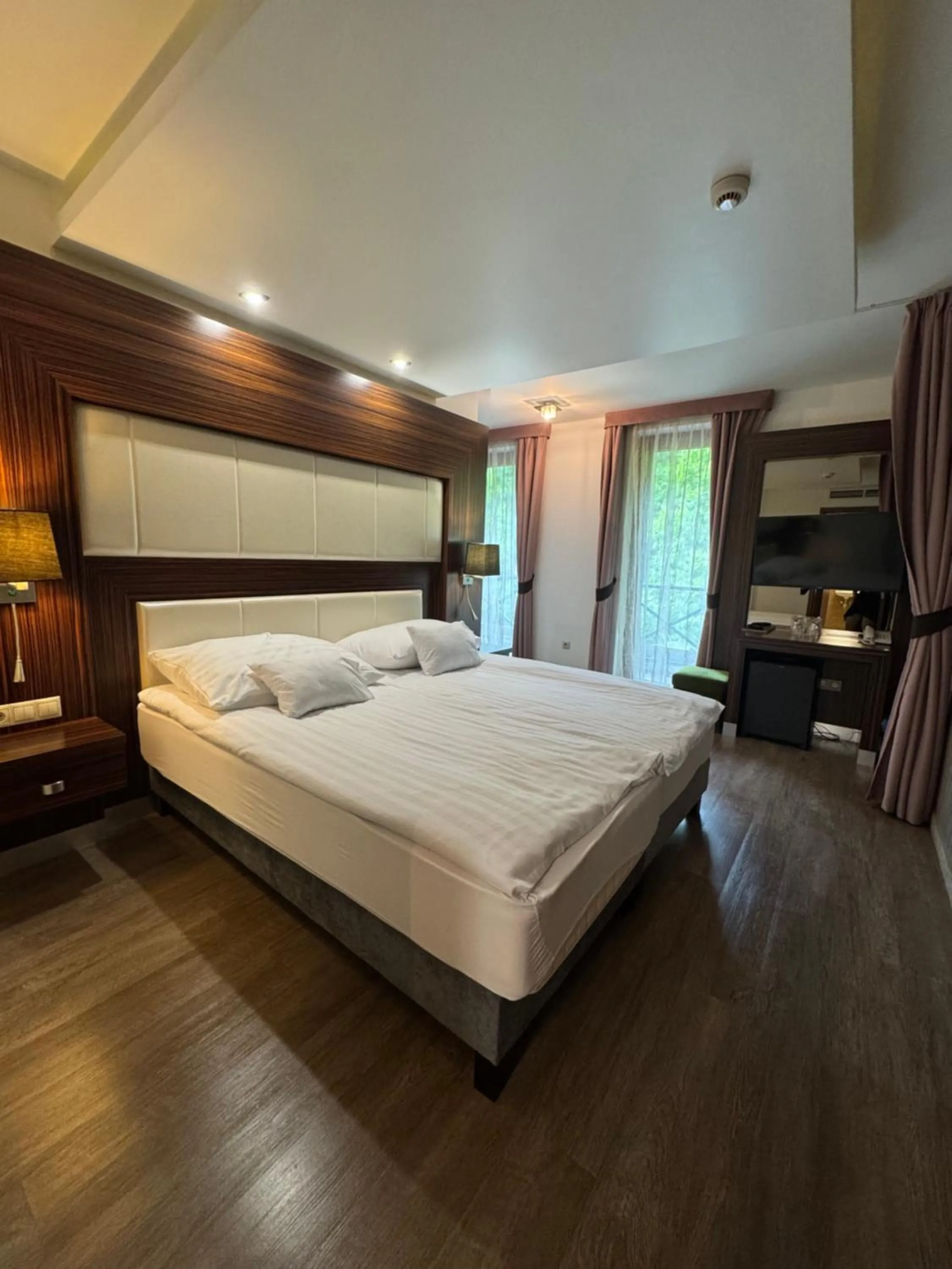 Bed in Duna Garden Hotel