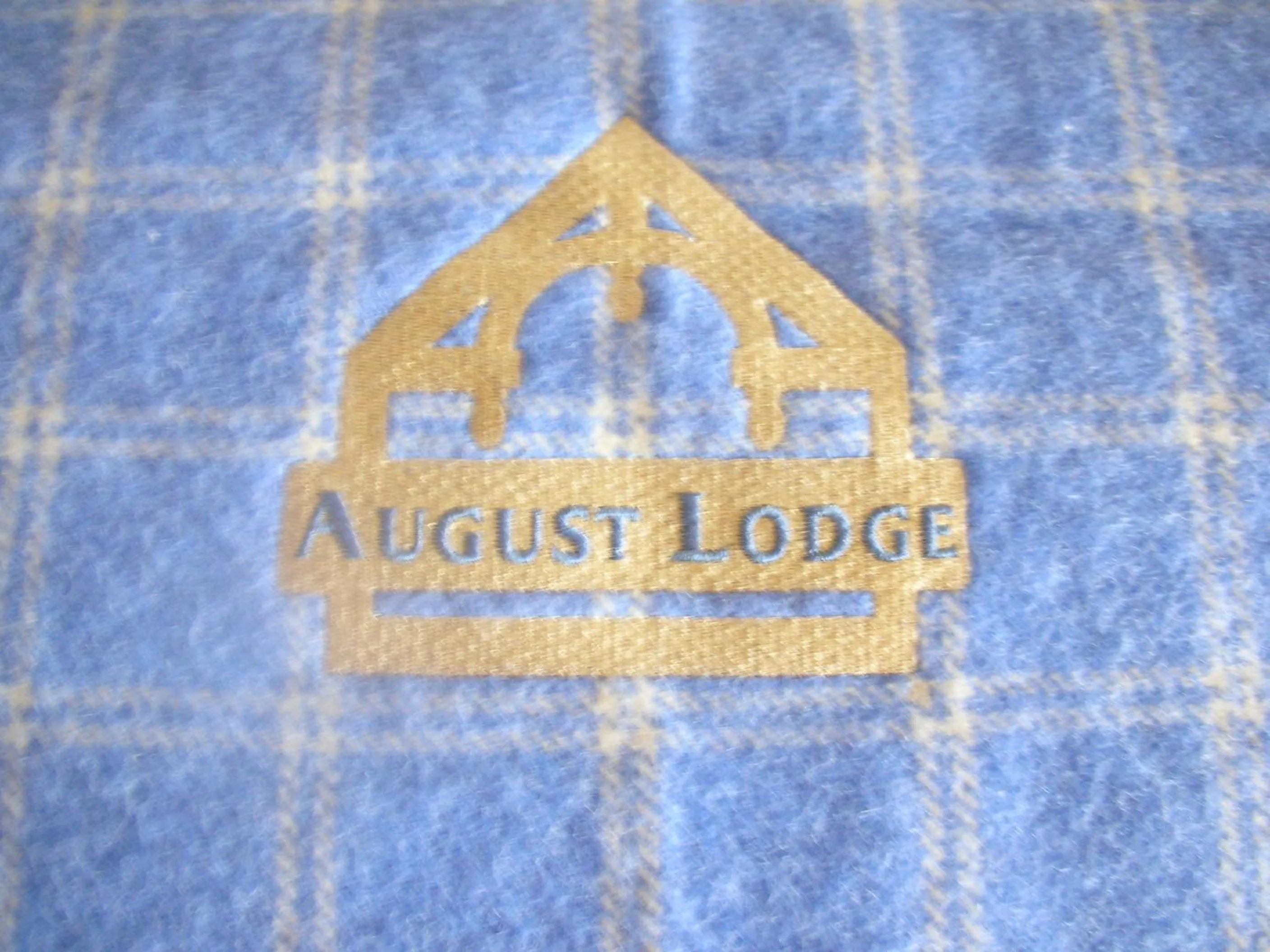 Property logo or sign in August Lodge Cooperstown
