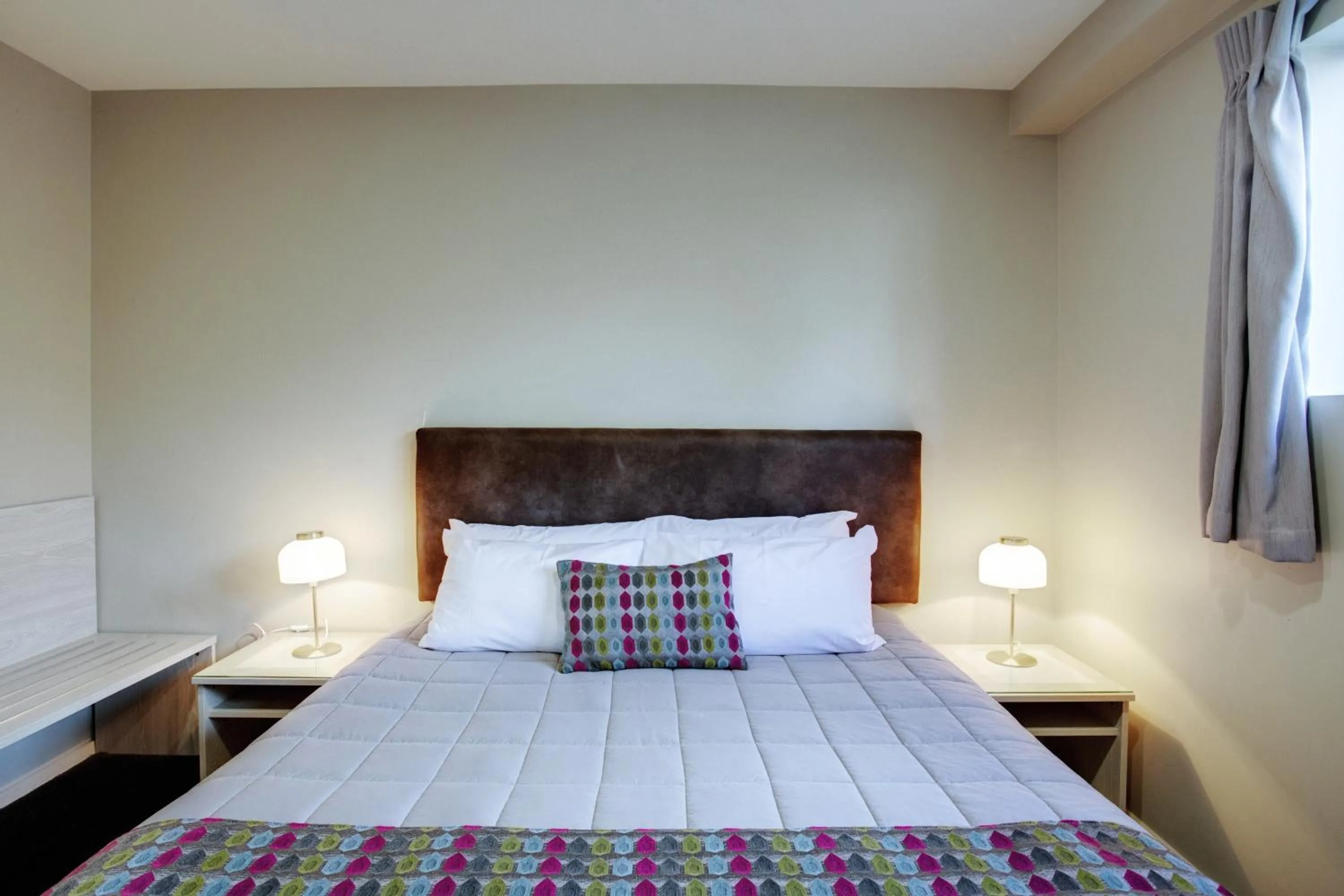 Bed in Ellerslie Palms Motel