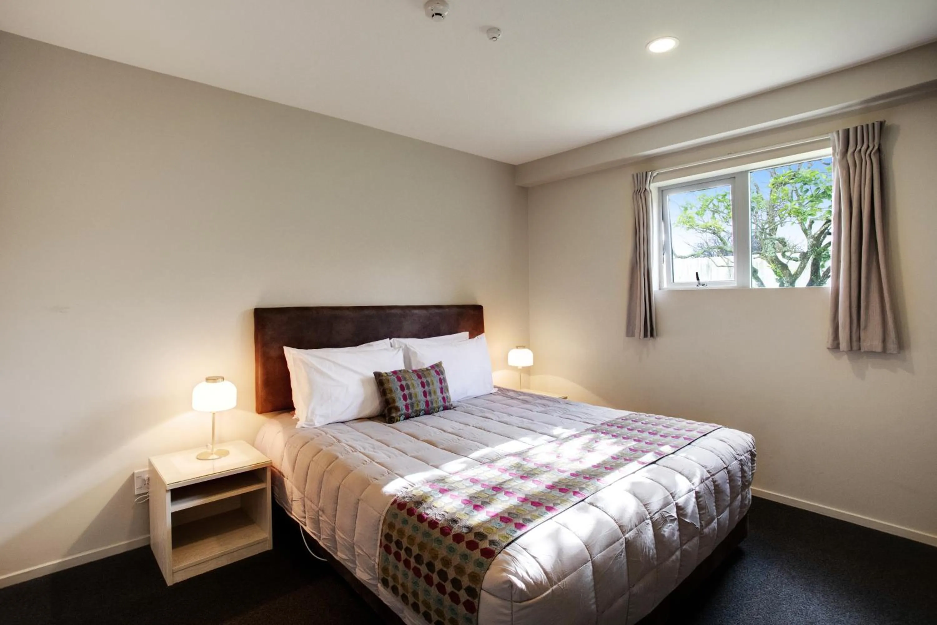 Bed in Ellerslie Palms Motel