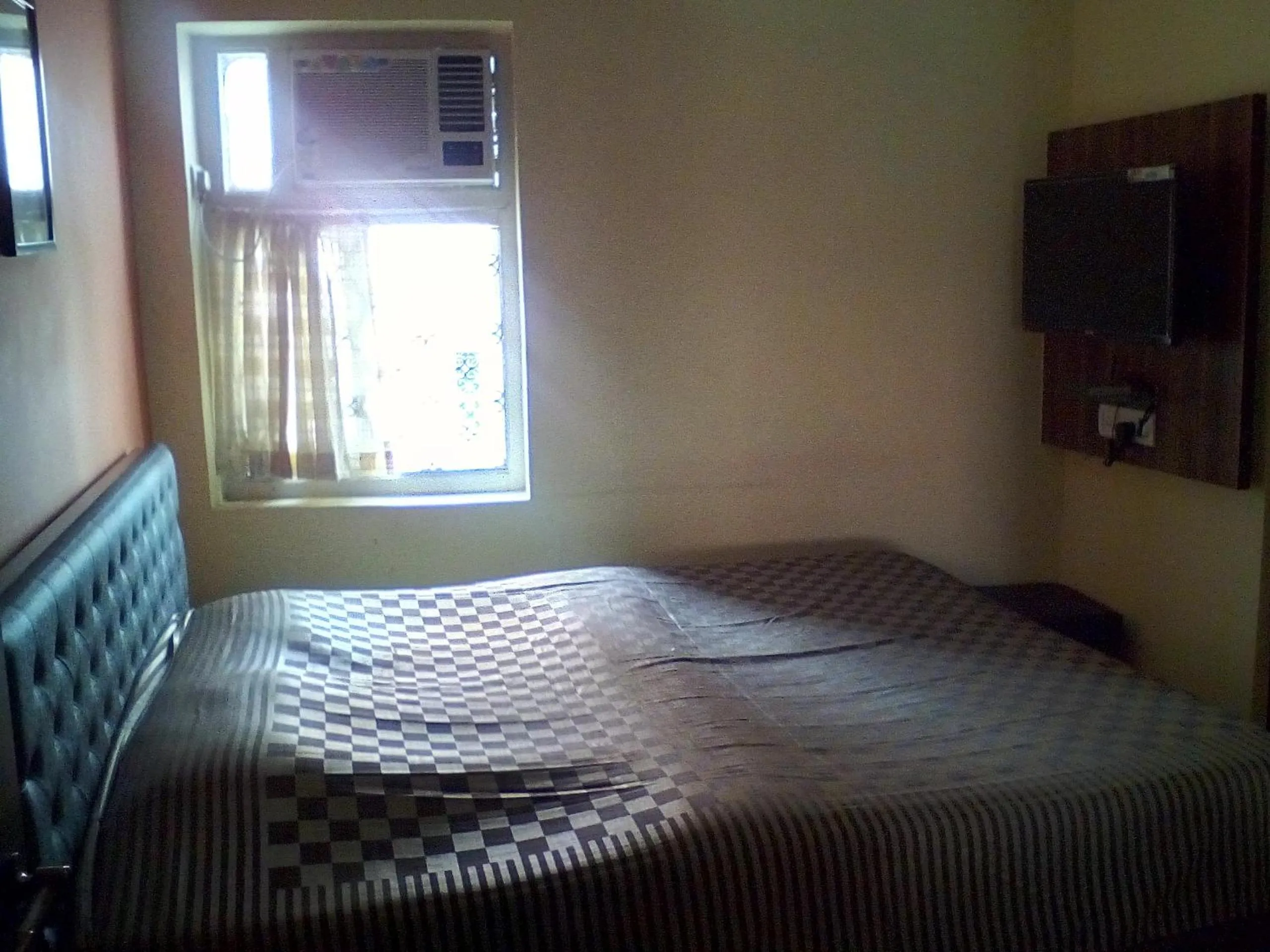 Bed in Om Sai Villa Guesthouse