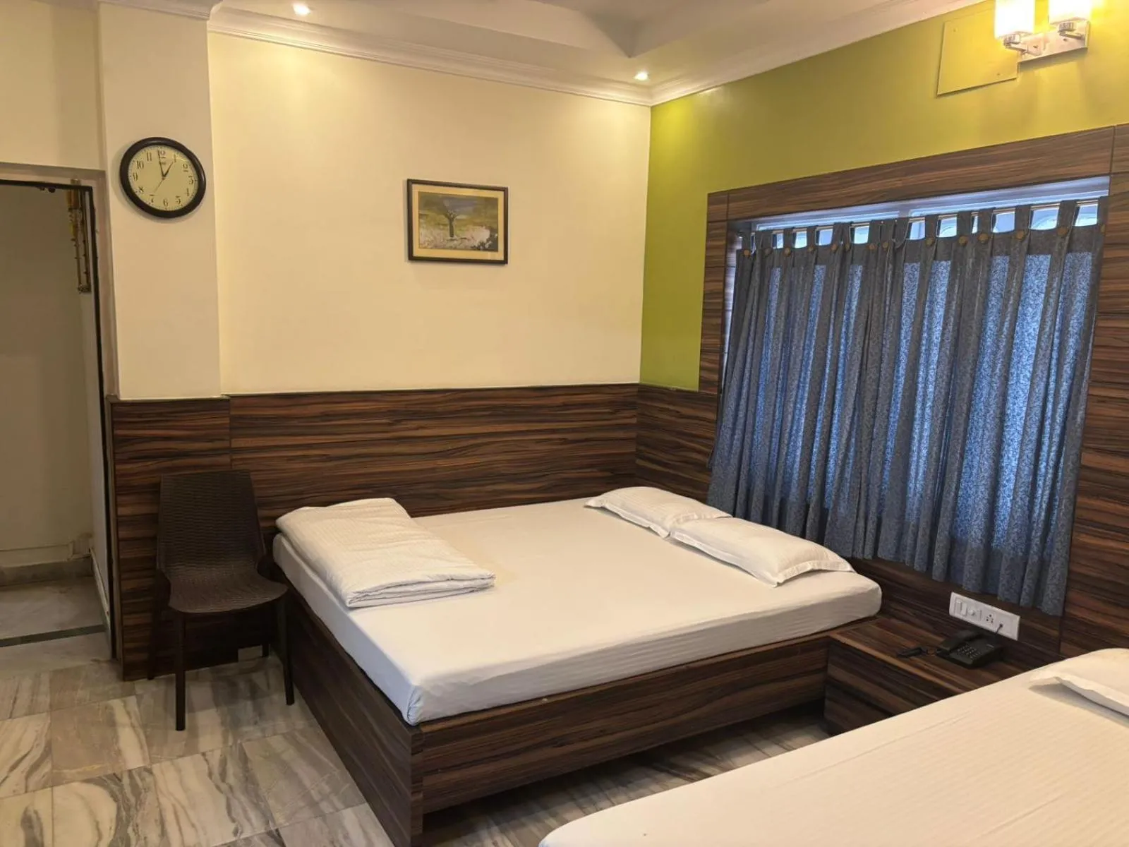 Bed in Om Sai Villa Guesthouse