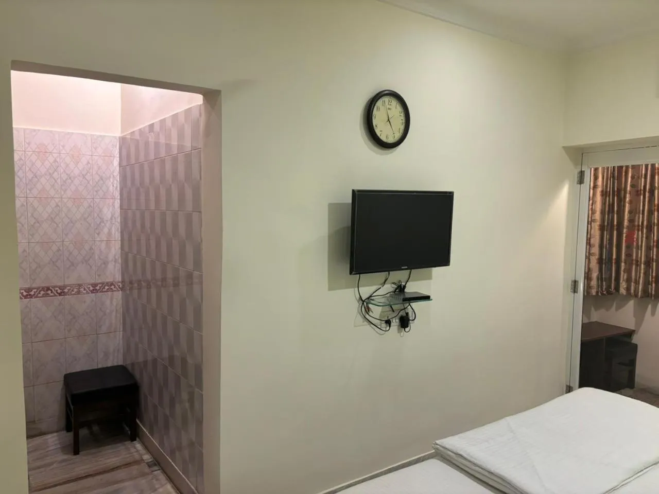 Bed in Om Sai Villa Guesthouse