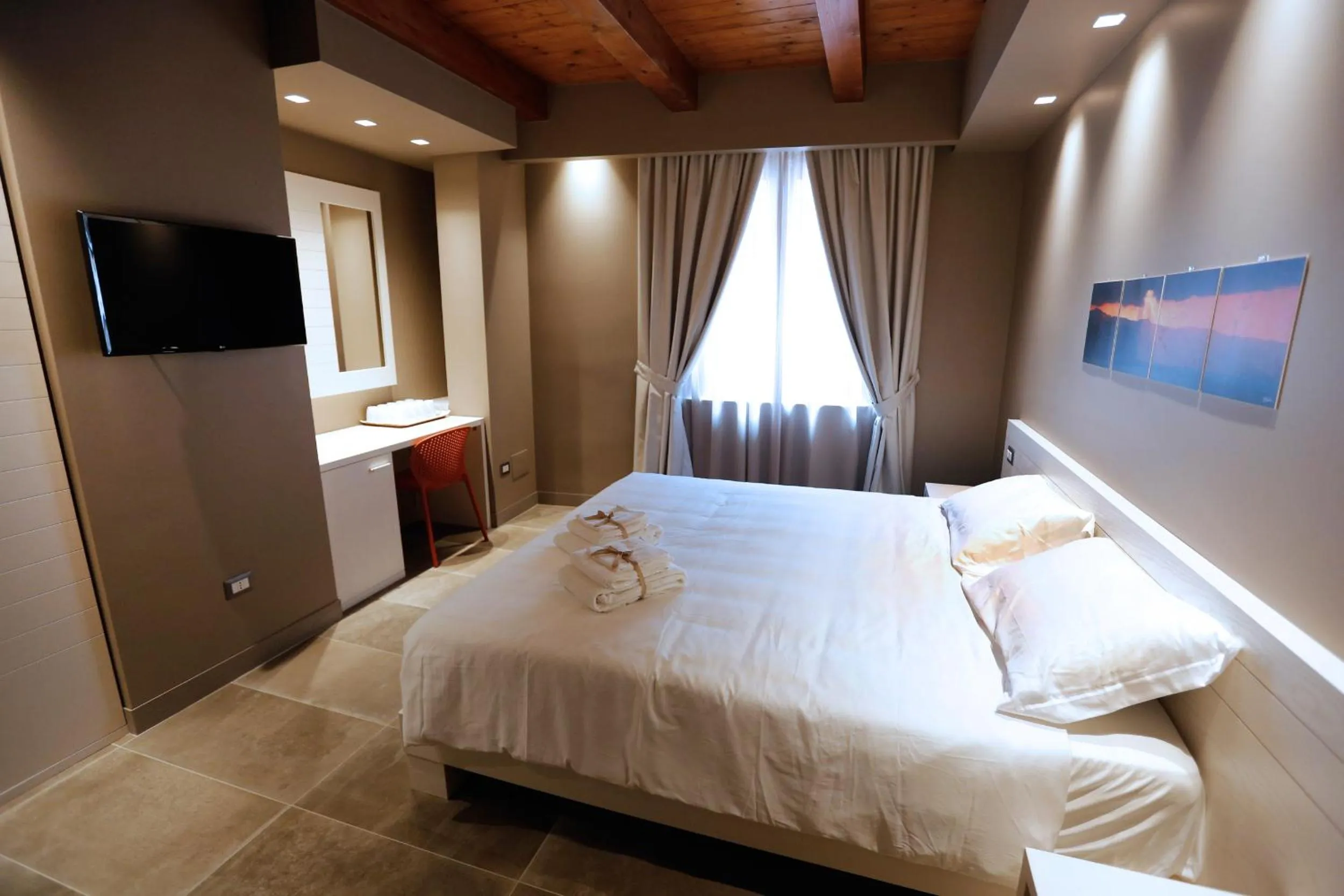 Bed in Il Casato Deluxe Rooms