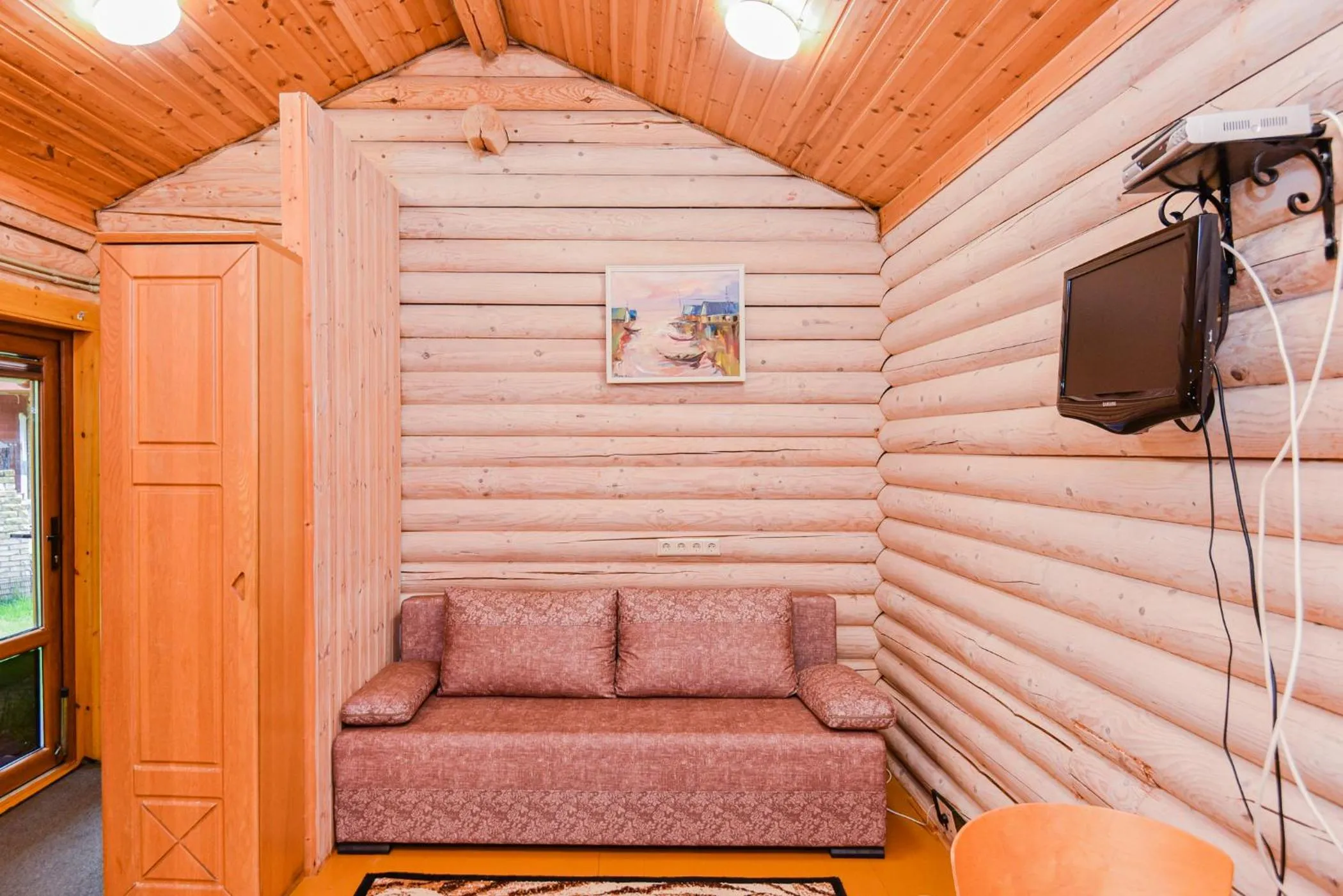 Communal lounge/ TV room in Eimio Vila
