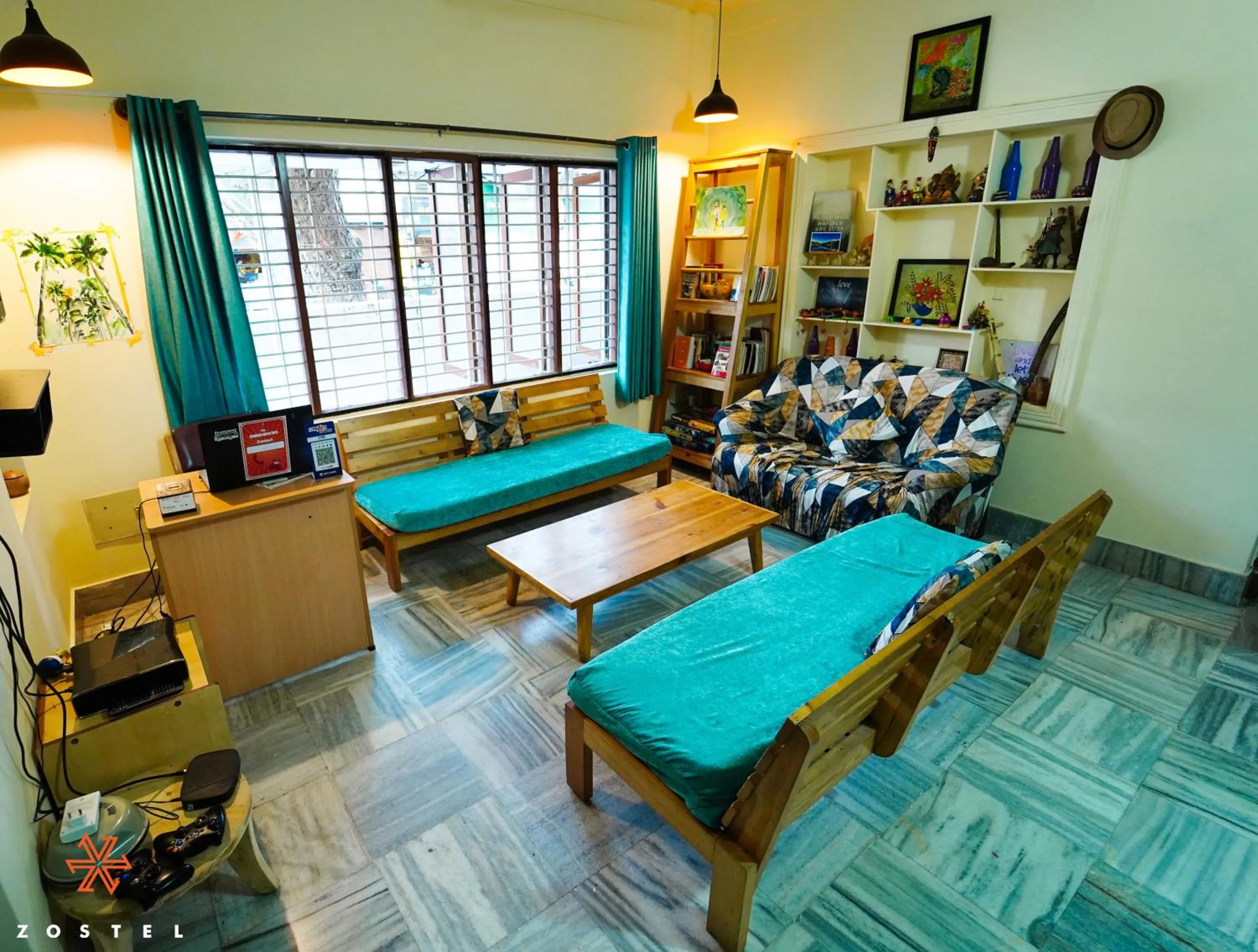 Communal lounge/ TV room, Bed in Zostel Mysore