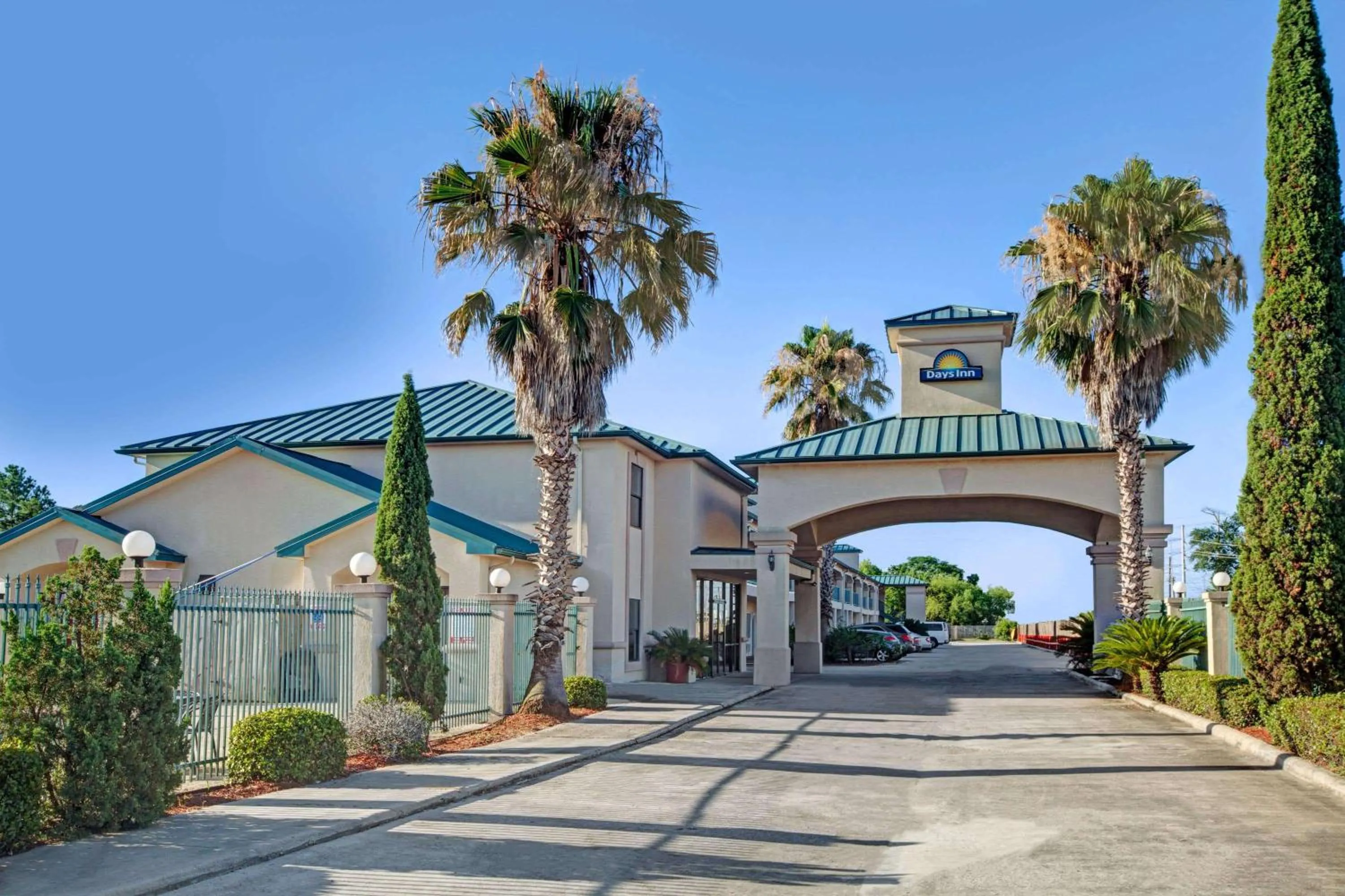 Property building in Days Inn & Suites by Wyndham Houston North - Spring