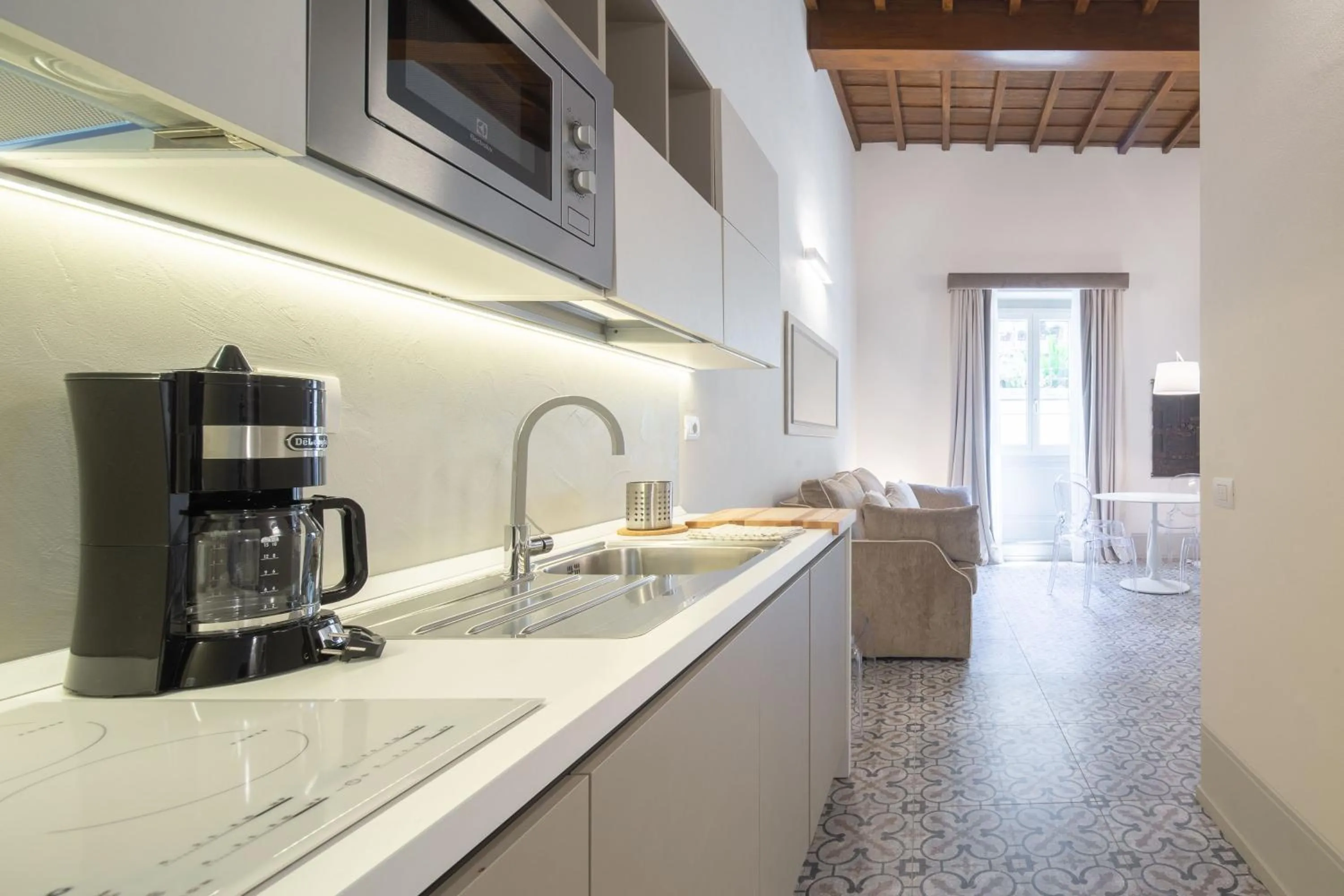 Kitchen or kitchenette in Carapelli Apartments