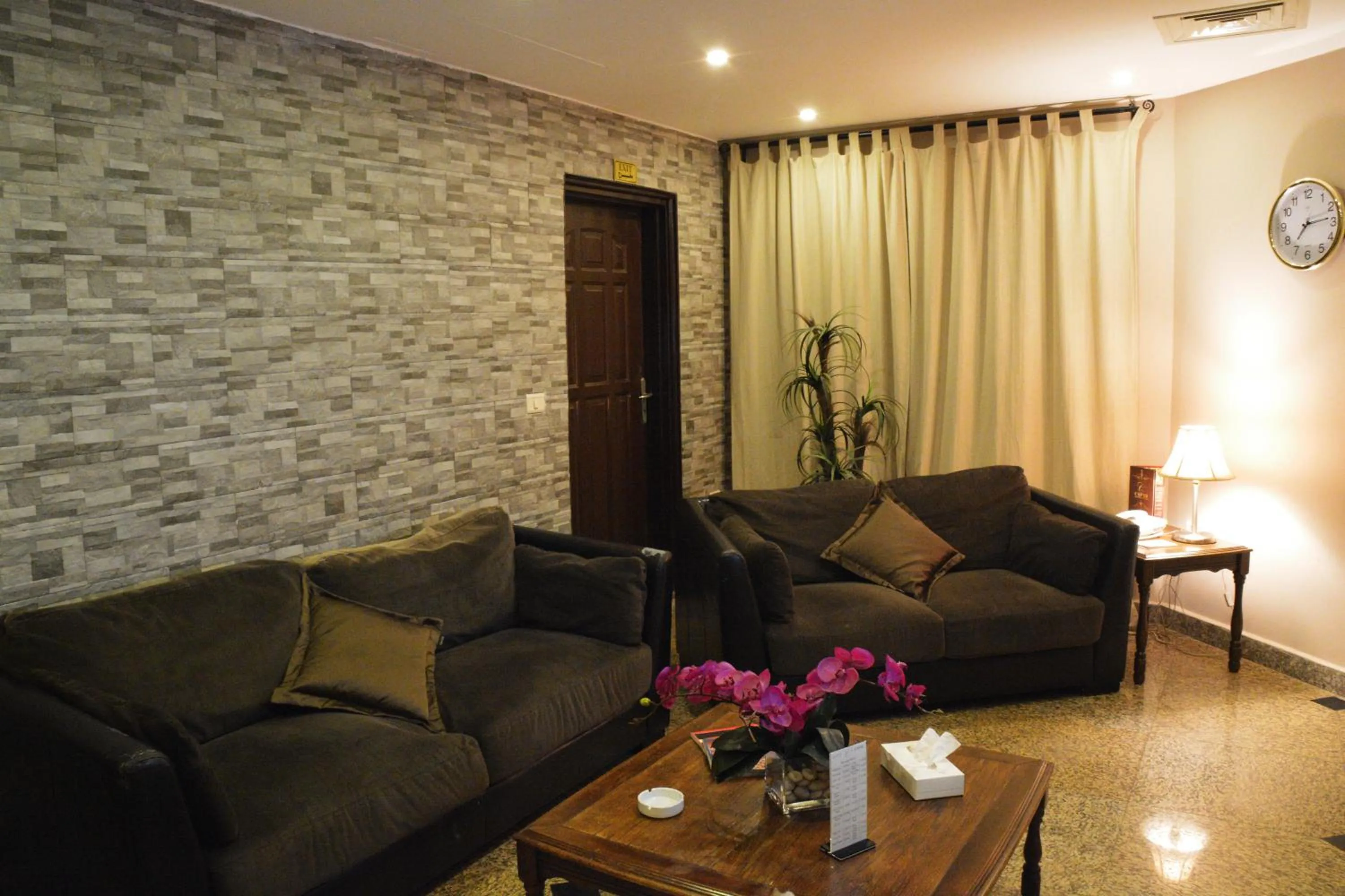 Seating area in Capri Hotel Suites