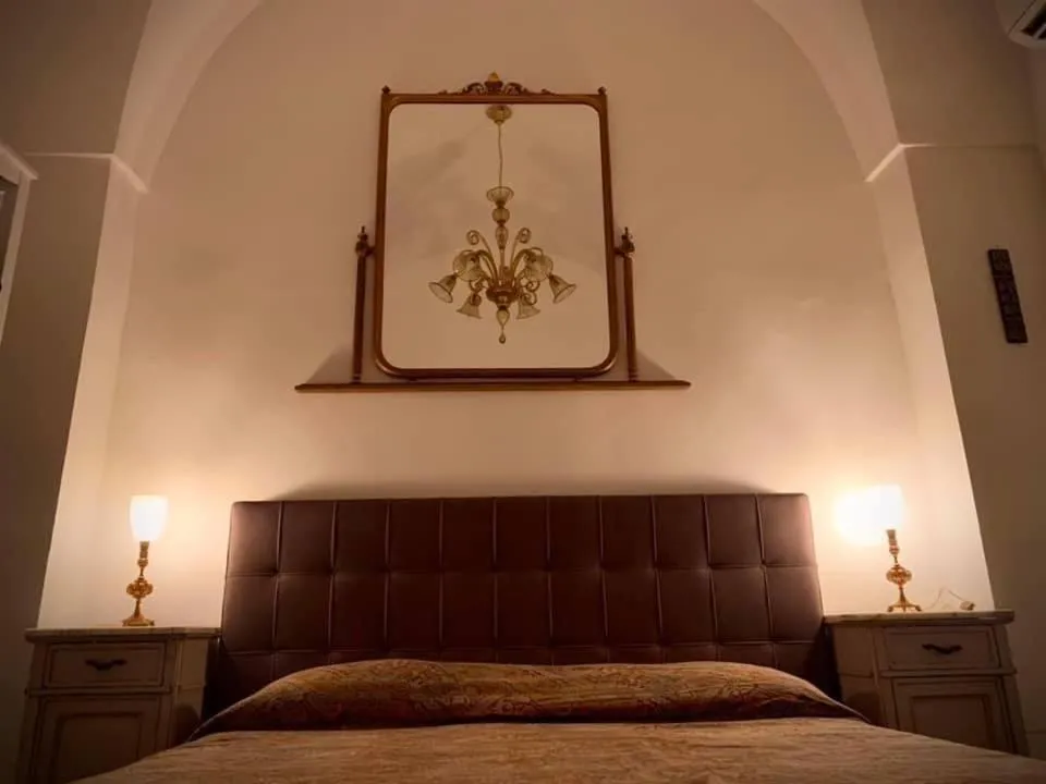 Bed in Dimora luxury Santa Lucia Apartaments