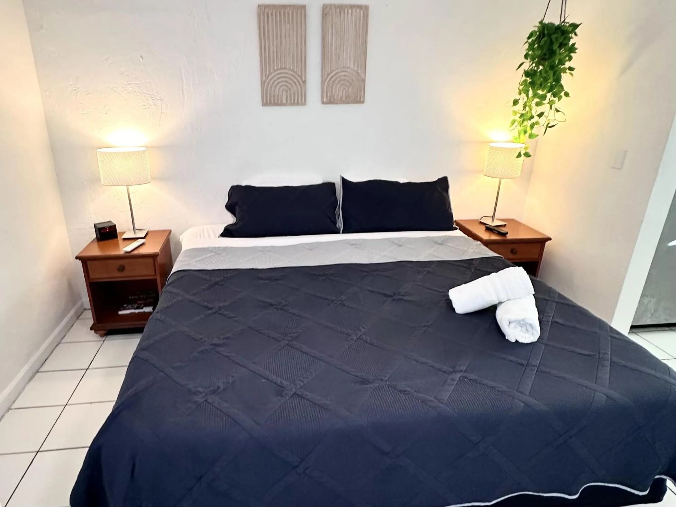 Bed in Southwinds Inn by The Gold Nests