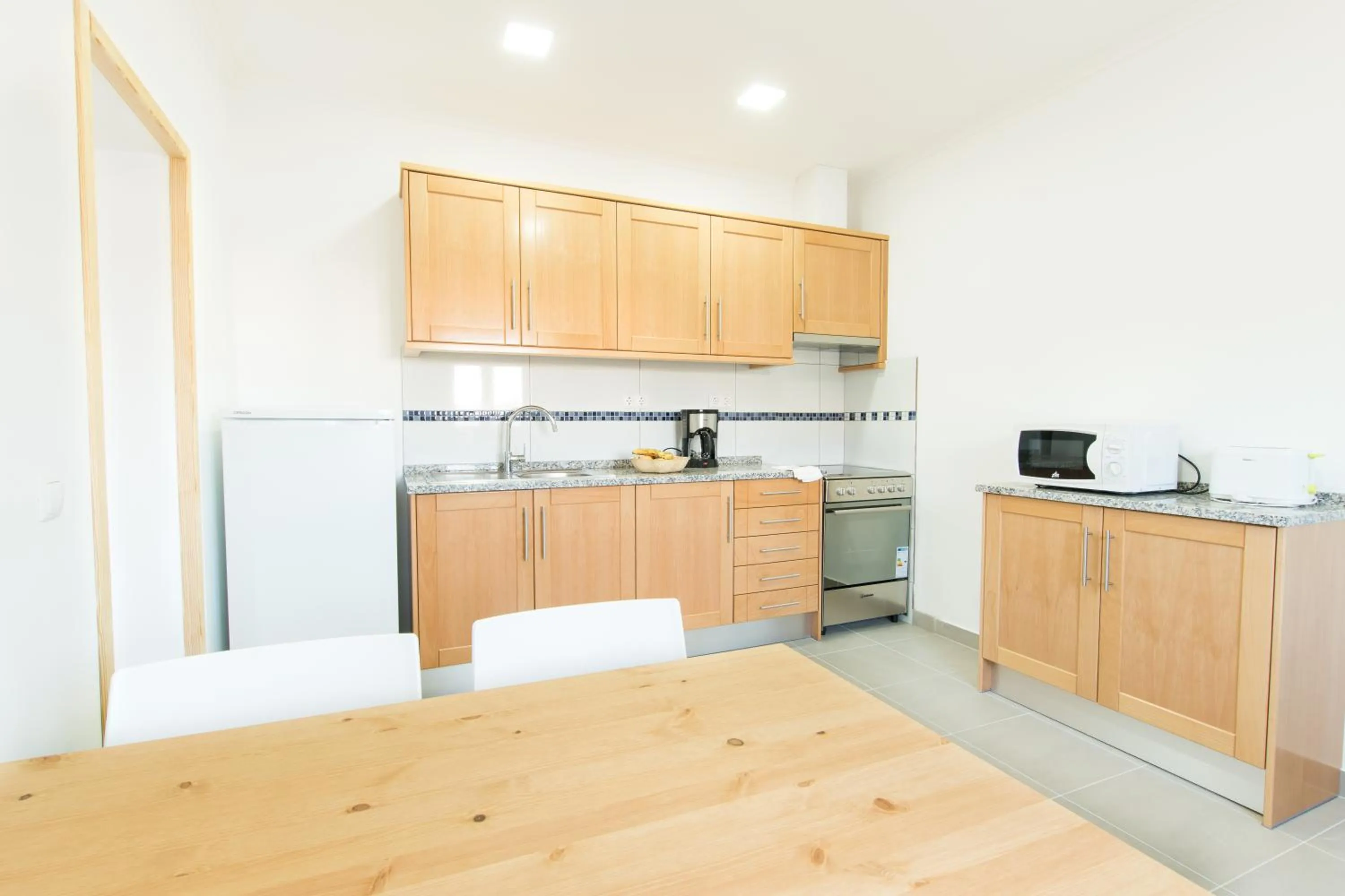 Kitchen or kitchenette in Tonel Apartamentos Turisticos