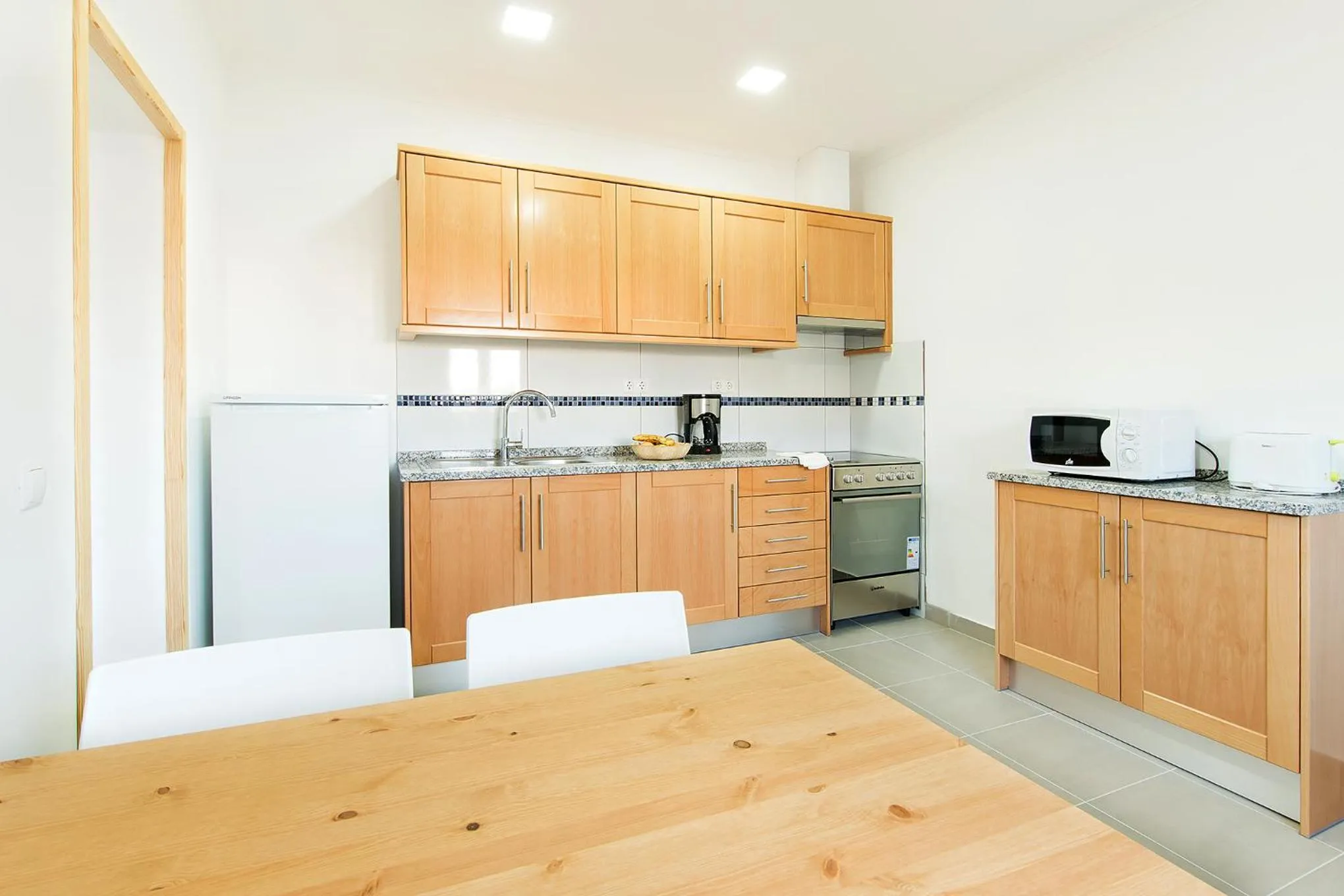 Kitchen or kitchenette in Tonel Apartamentos Turisticos