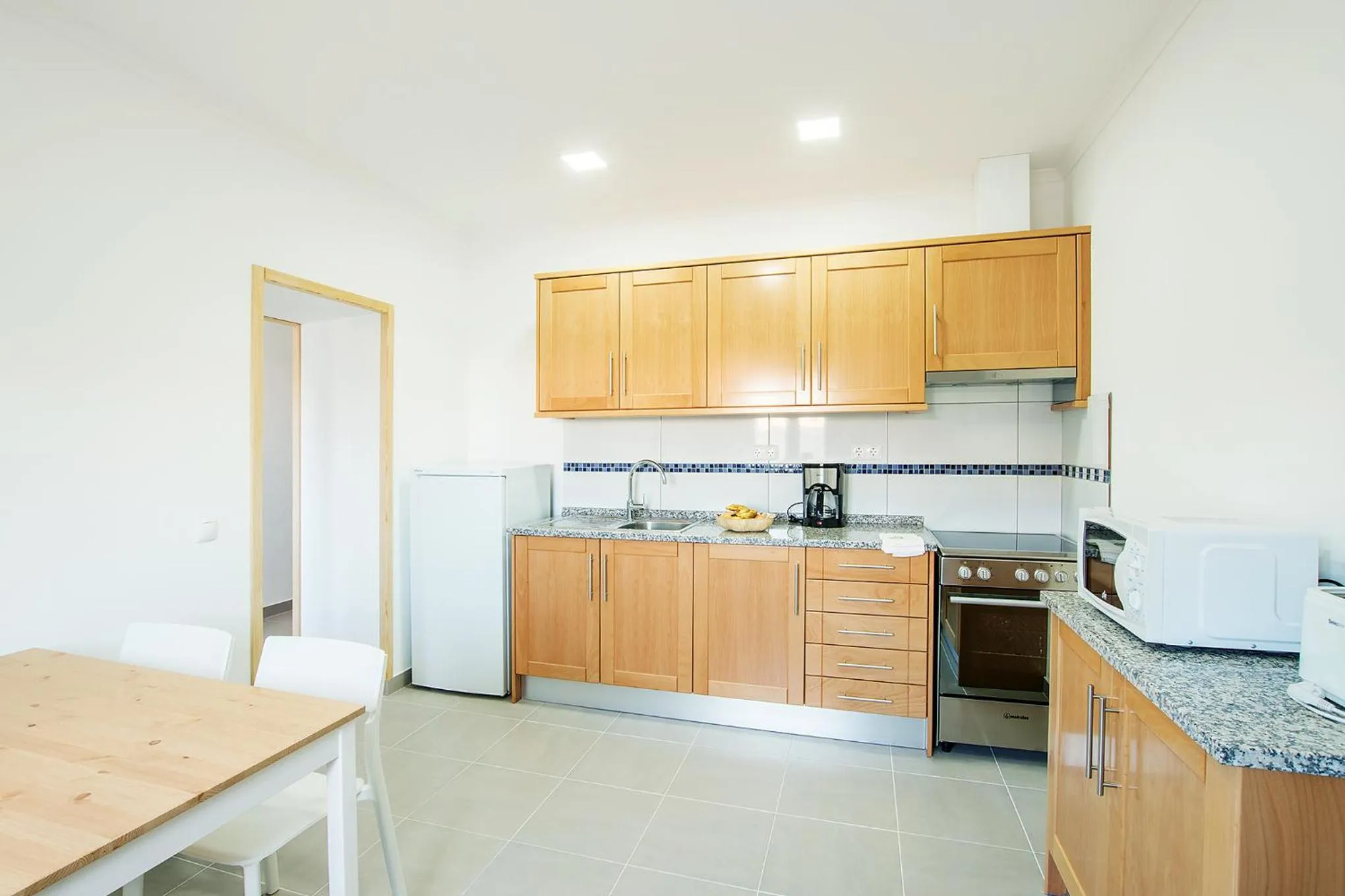 Kitchen or kitchenette in Tonel Apartamentos Turisticos