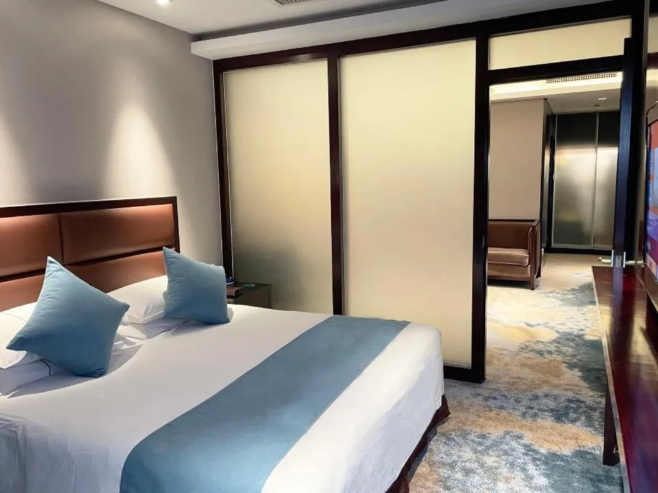 Bed in Royal Palace Hotel Haining