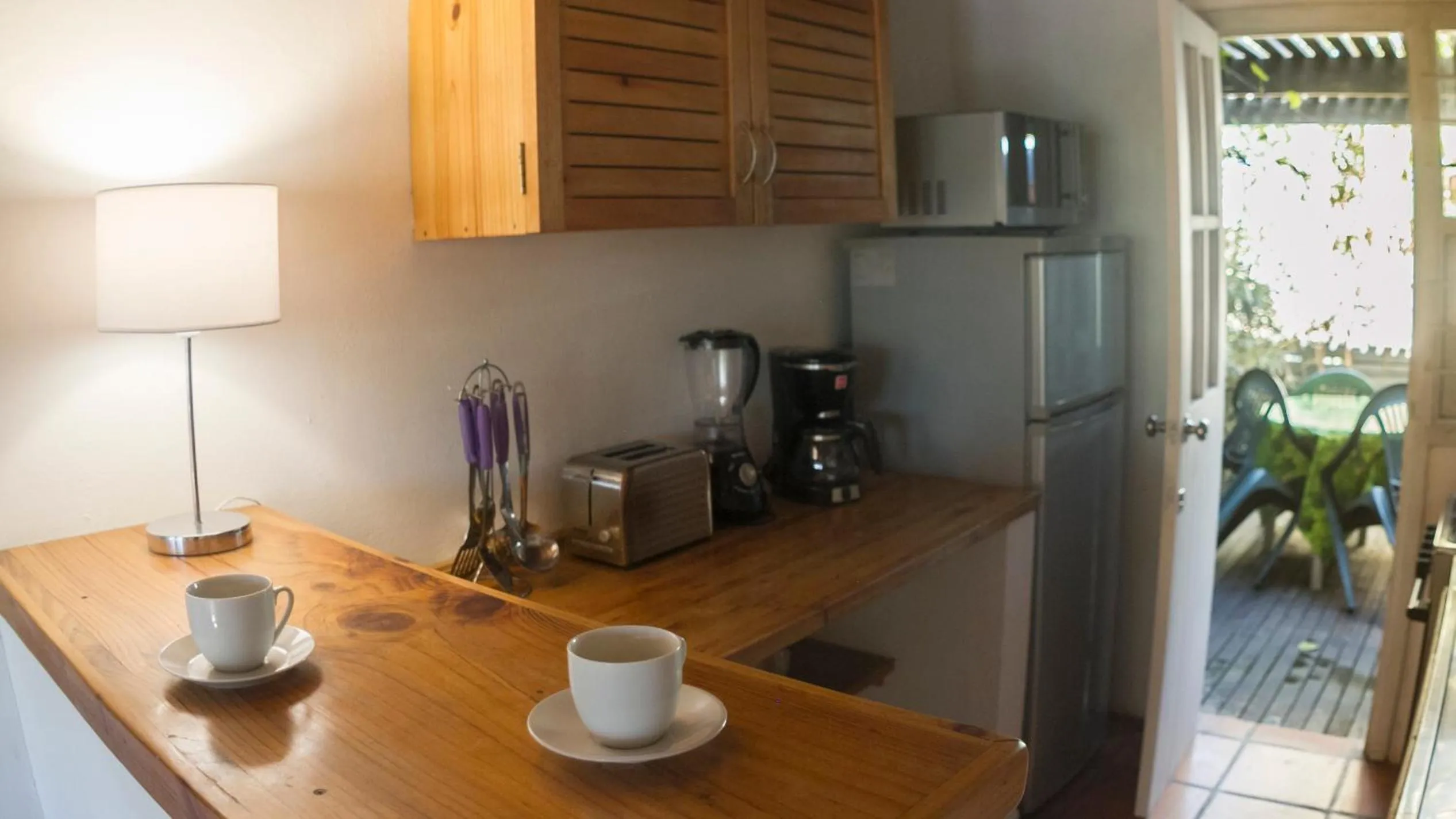 Kitchen or kitchenette in Aloe Village Aparthotel & Spa