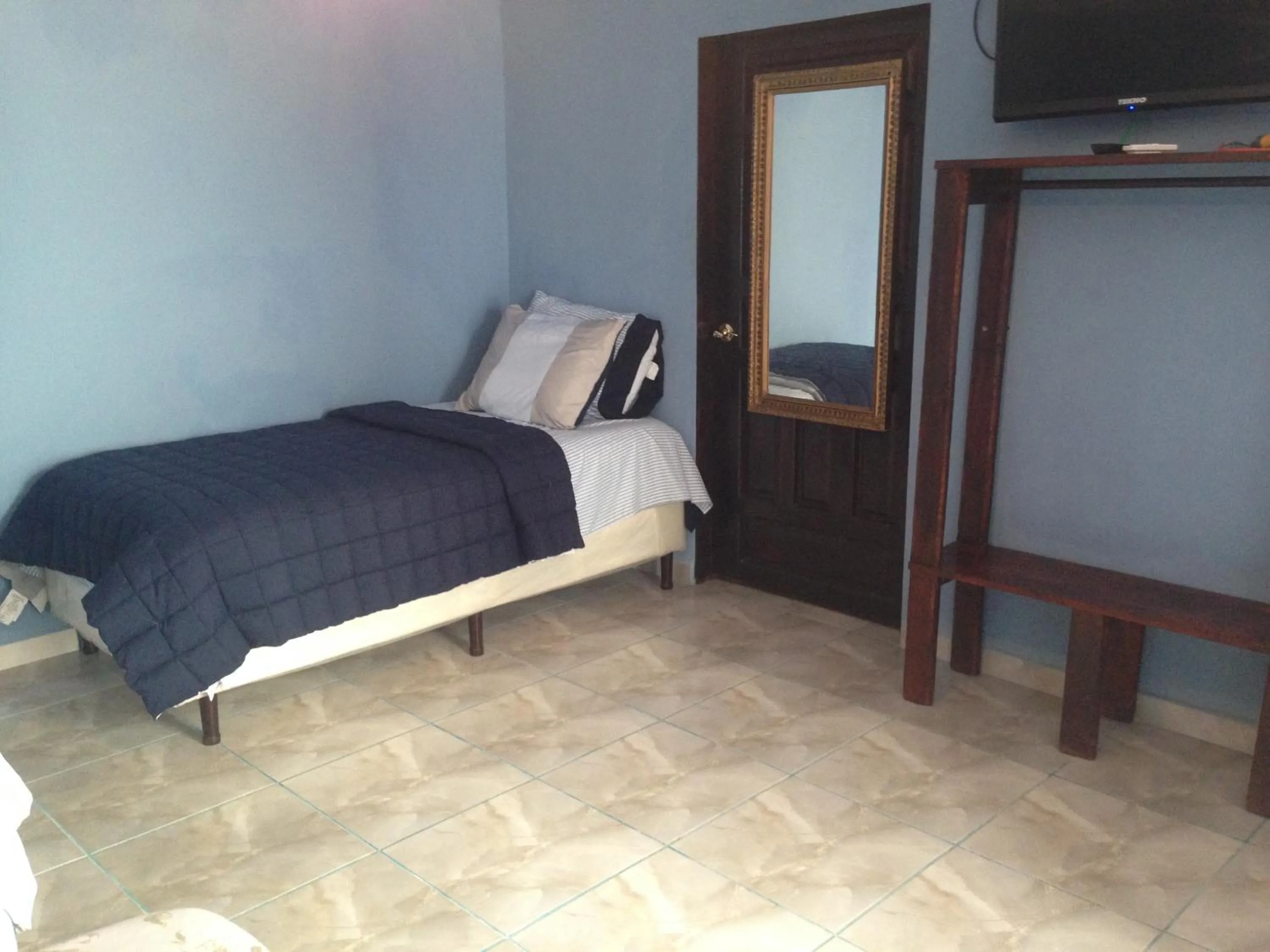 Bed in La Delphina Bed and Breakfast Bar and Grill