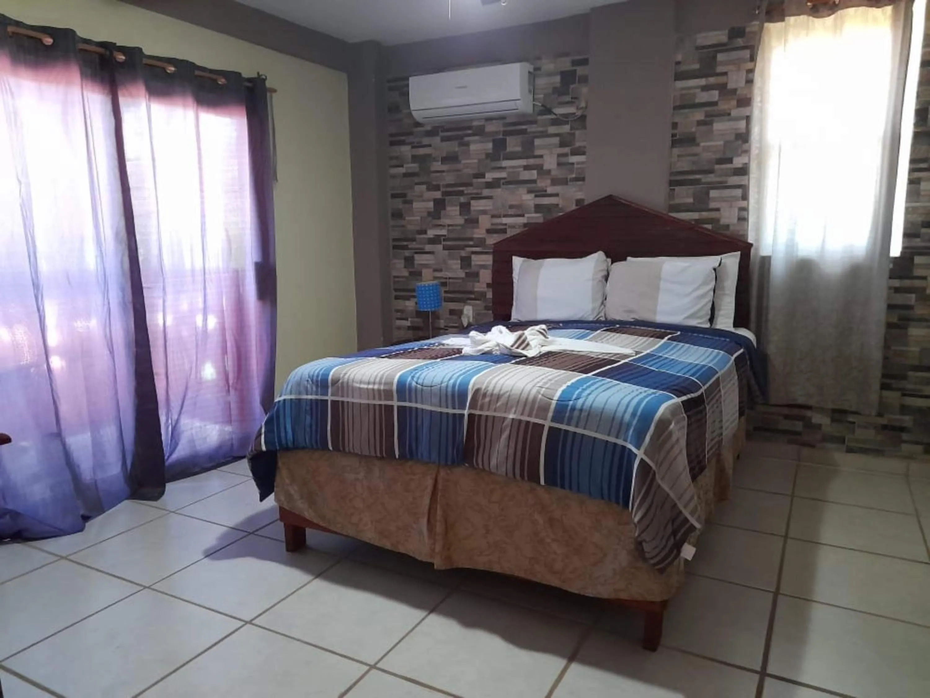 Bedroom in La Delphina Bed and Breakfast Bar and Grill