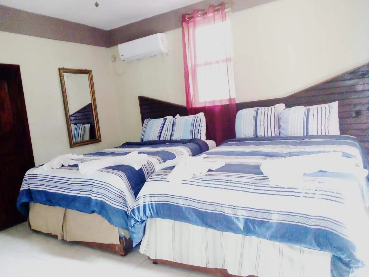 Bed in La Delphina Bed and Breakfast Bar and Grill