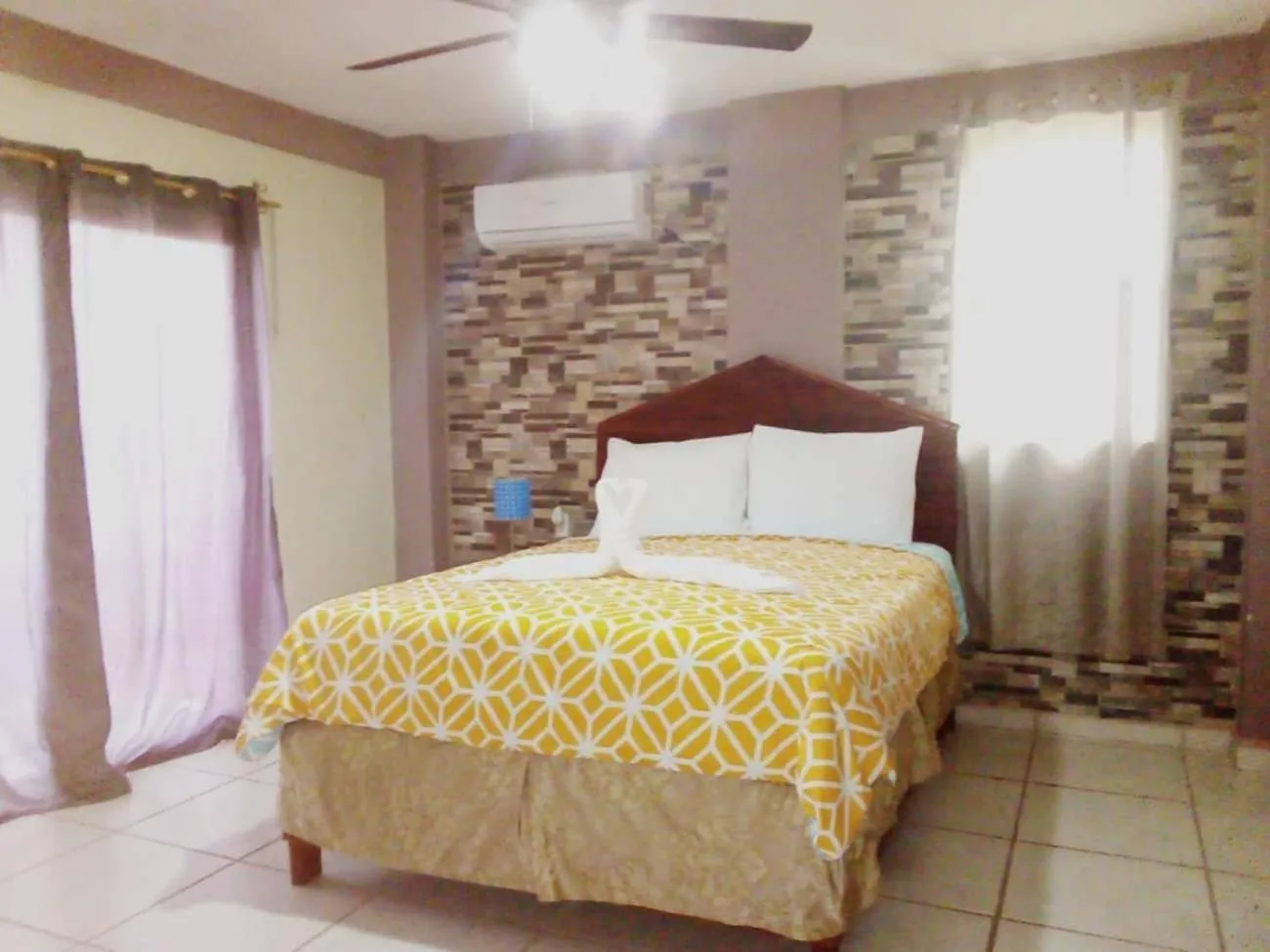 Bed in La Delphina Bed and Breakfast Bar and Grill