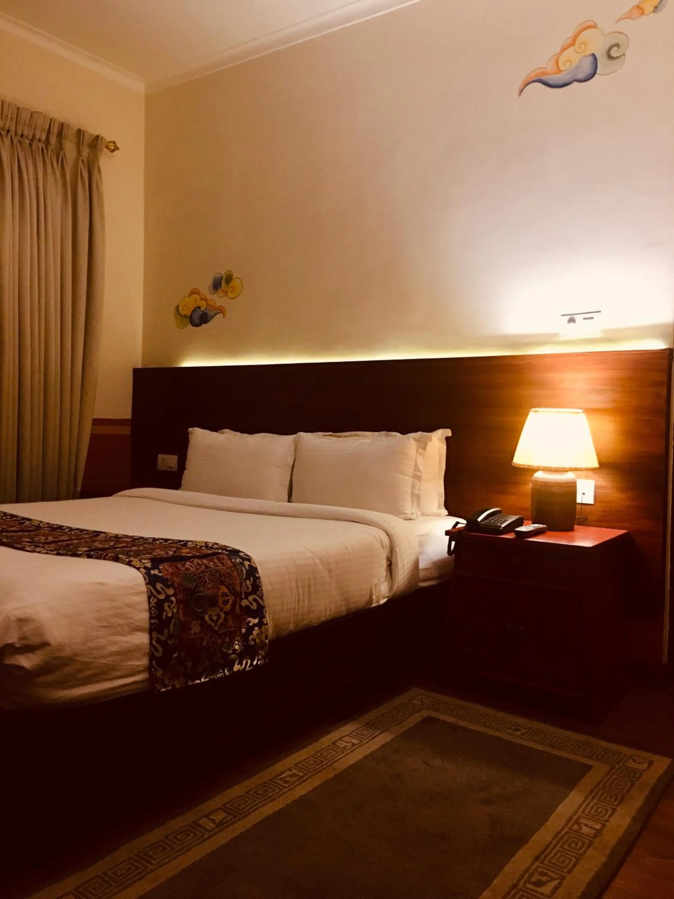 Bed in Three Jewels Boutique Hotel