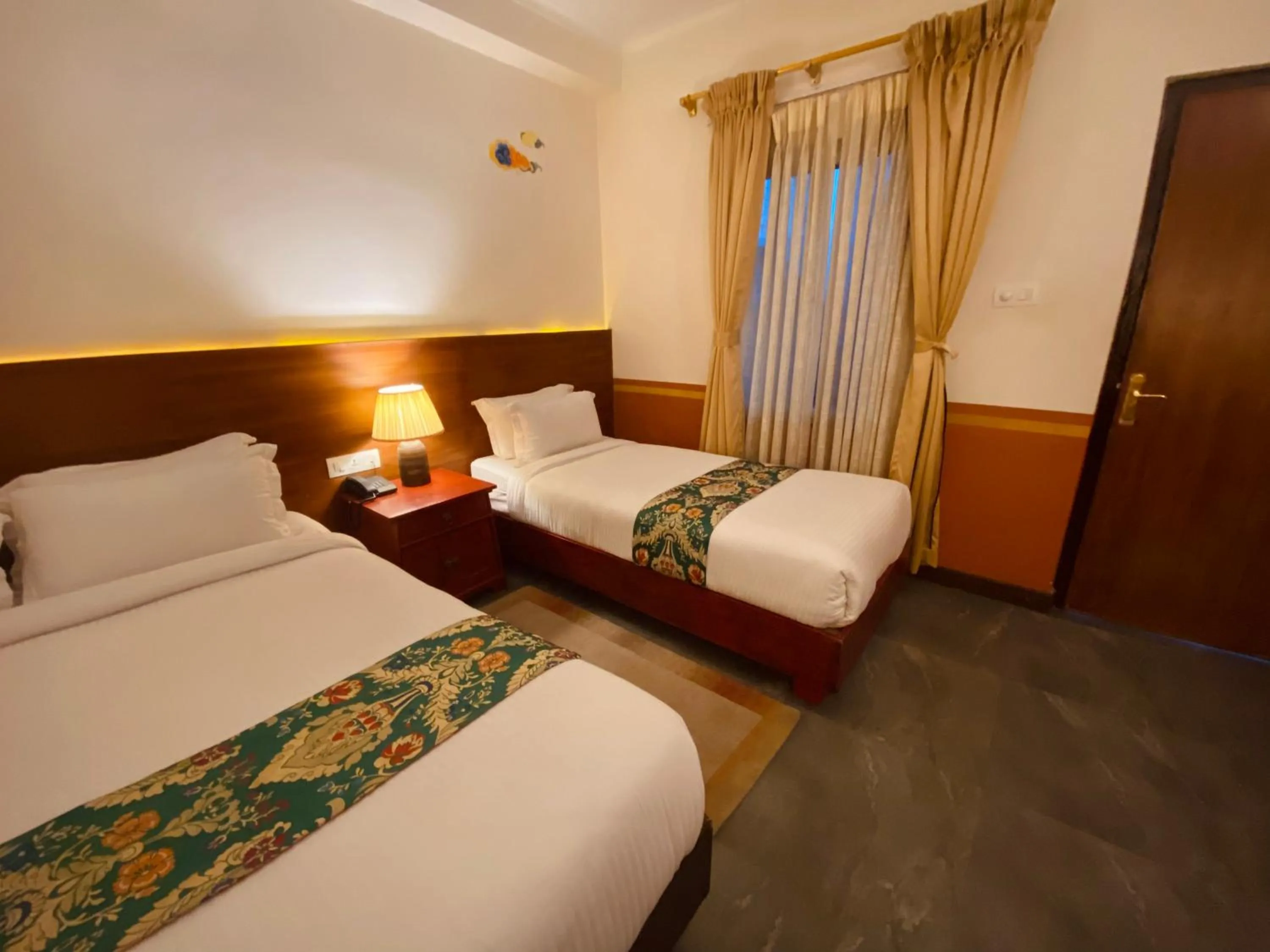 Bed in Three Jewels Boutique Hotel