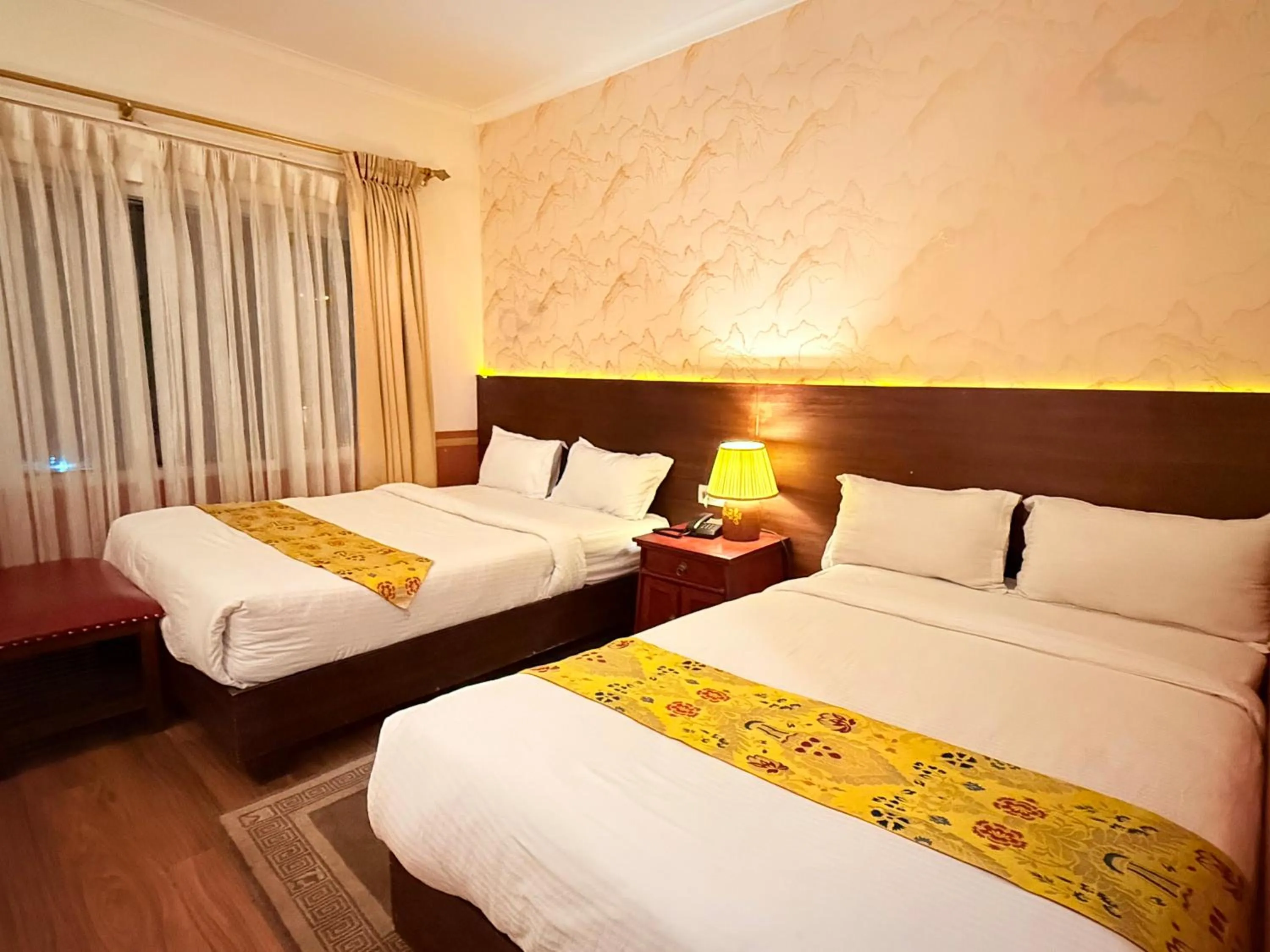 Bed in Three Jewels Boutique Hotel