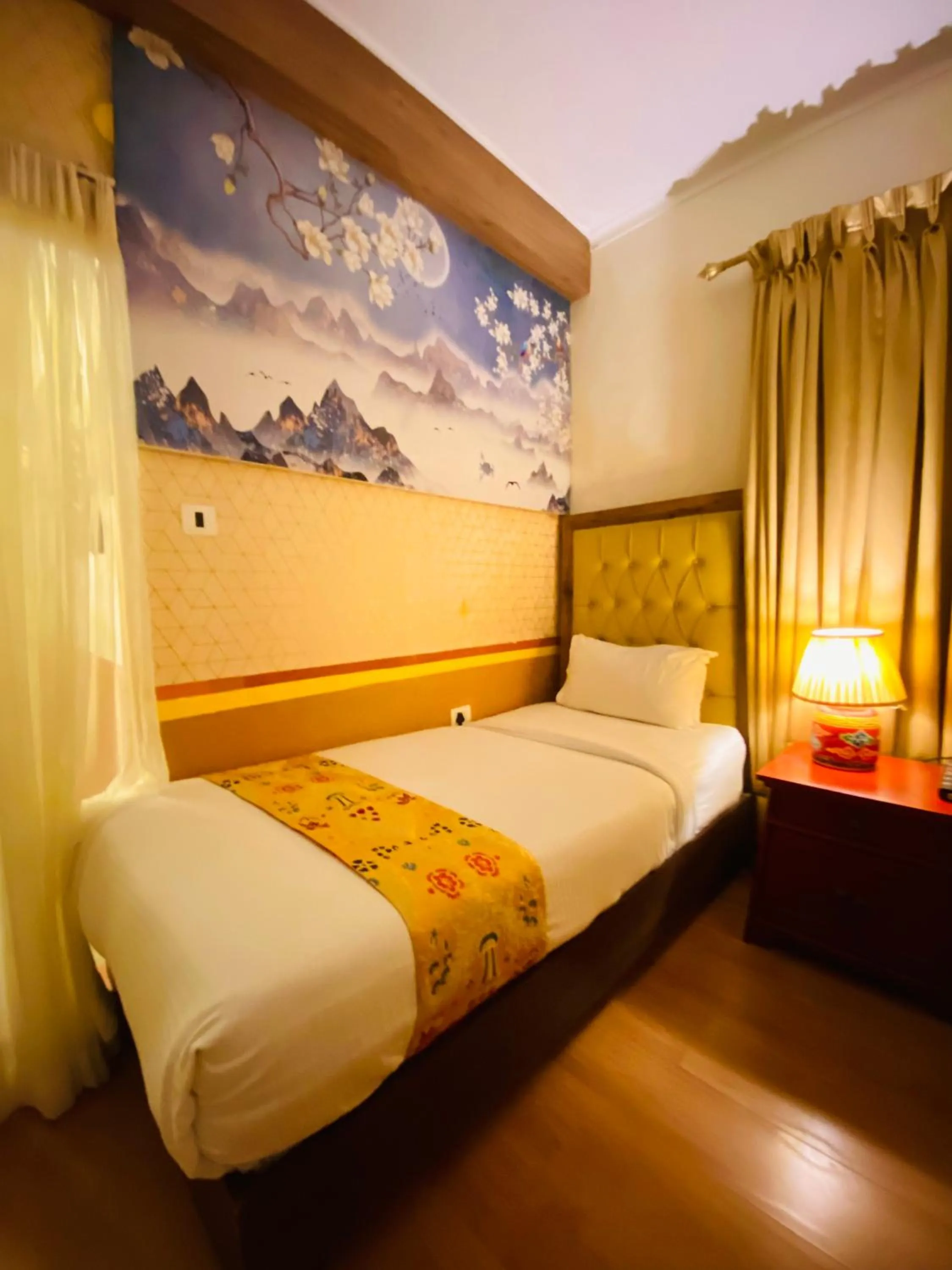 Bed in Three Jewels Boutique Hotel