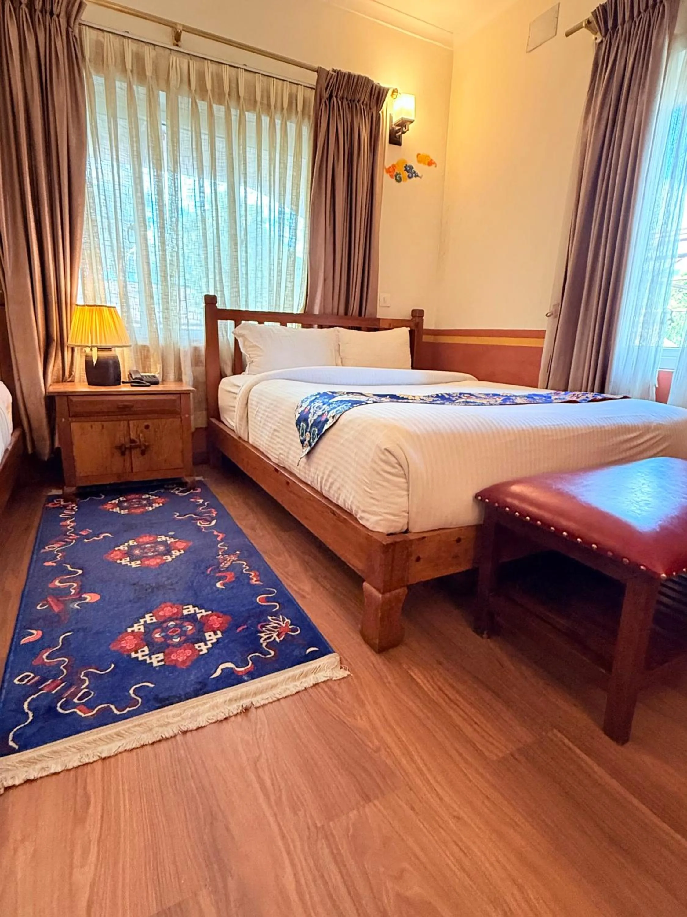 Bed in Three Jewels Boutique Hotel