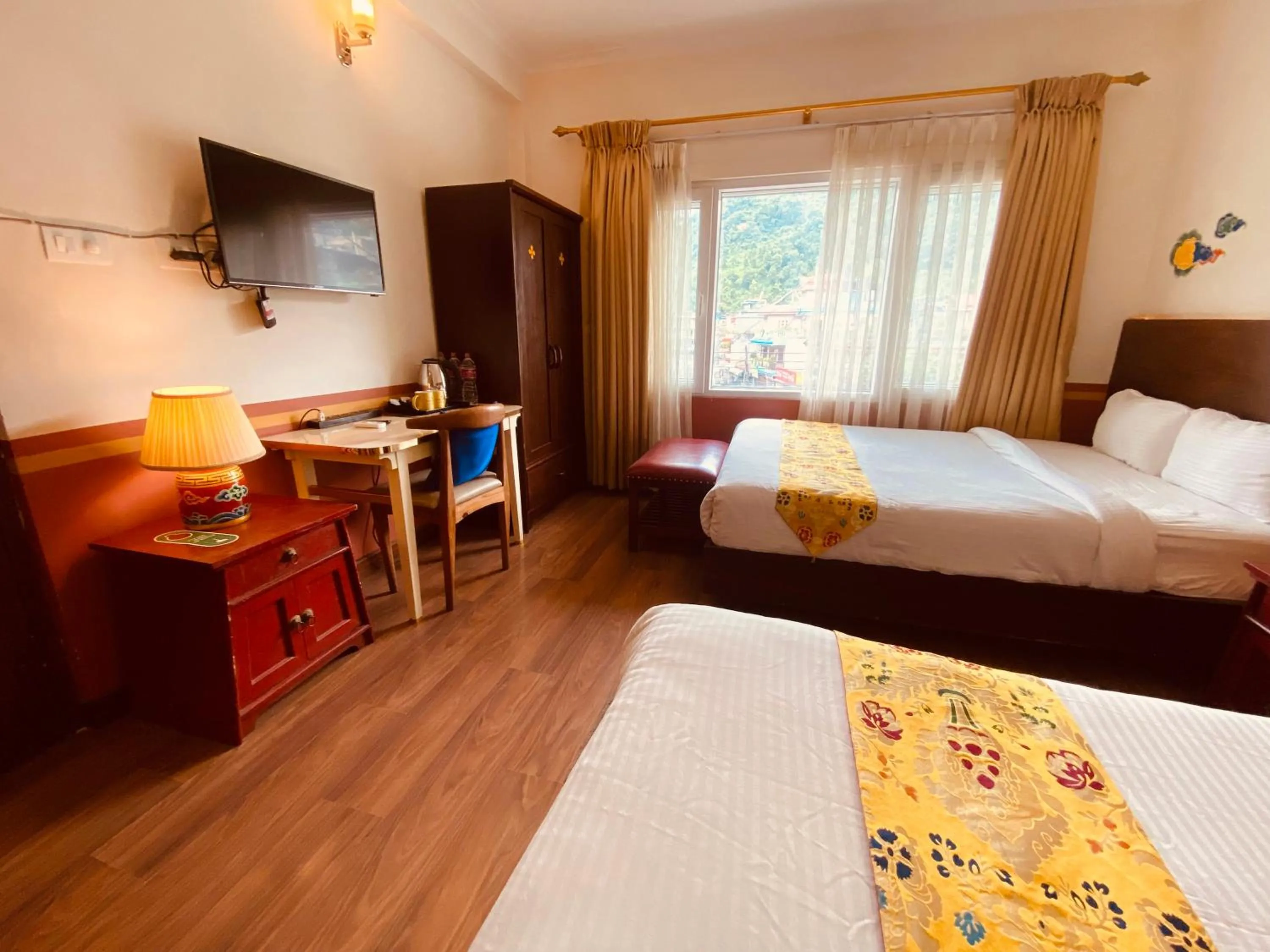 Bed in Three Jewels Boutique Hotel