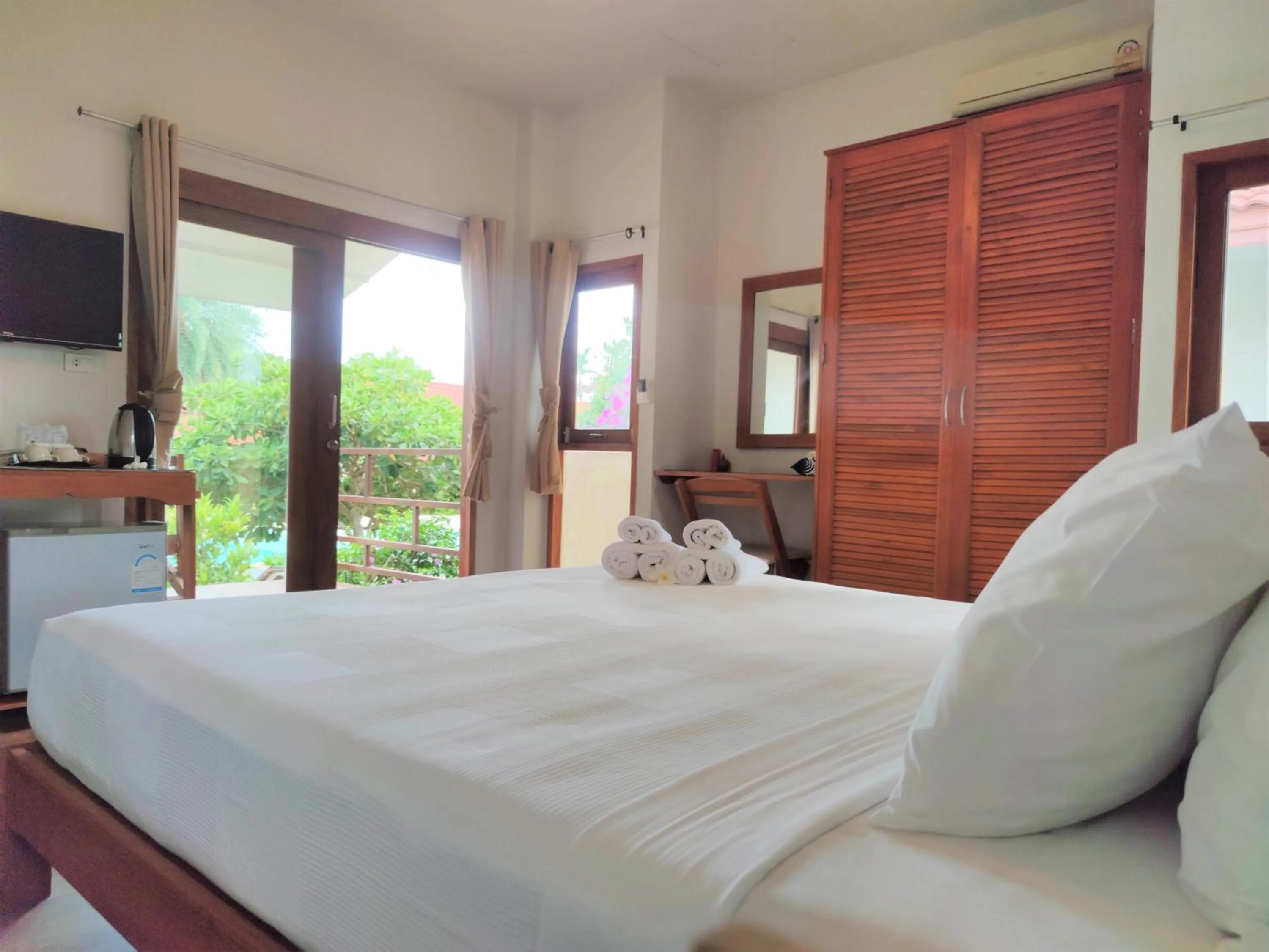 Bed in Armonia Village Resort and Spa